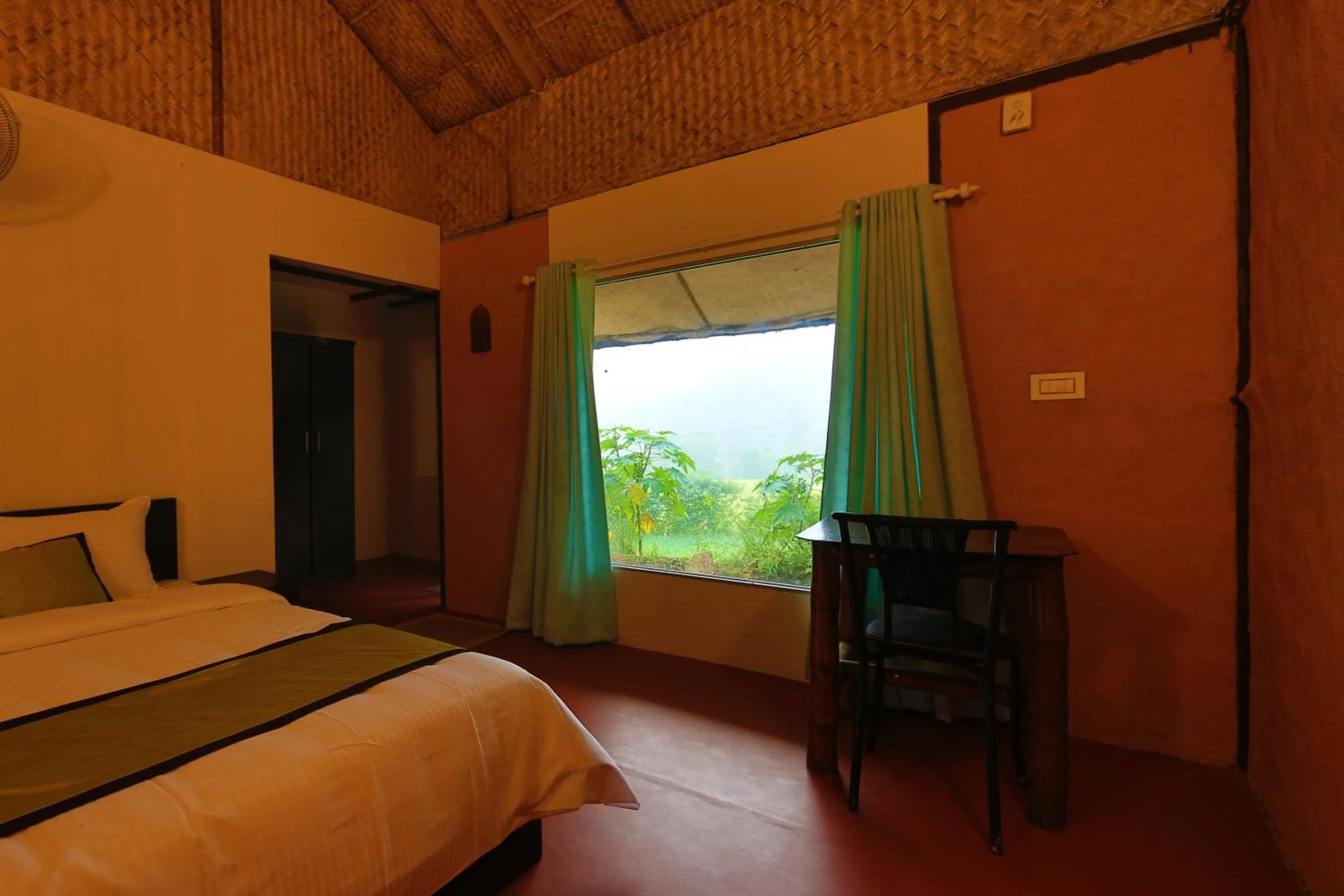 Photo of the whole room, Bed in KOOMANKOLLY RESORT