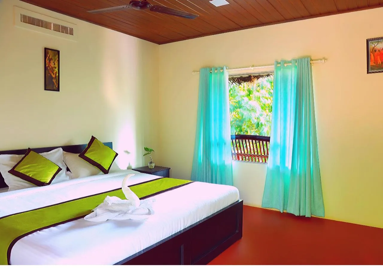 Bed in KOOMANKOLLY RESORT