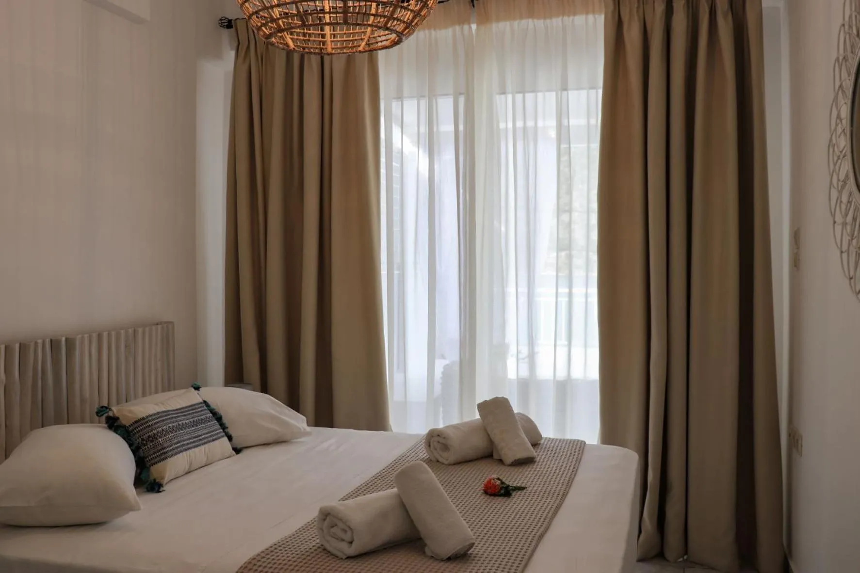 Bed in Grand Bleu Apartments & Villas