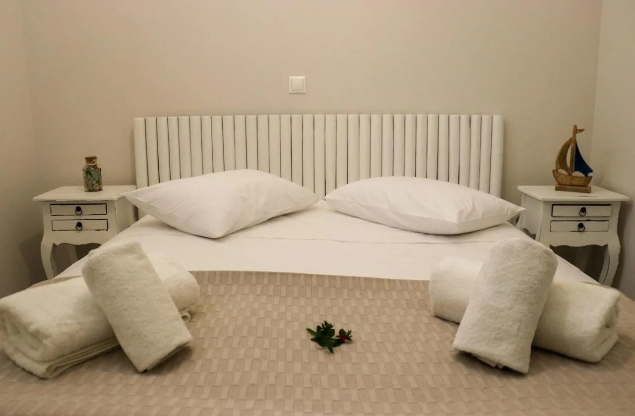 Bed in Grand Bleu Apartments & Villas