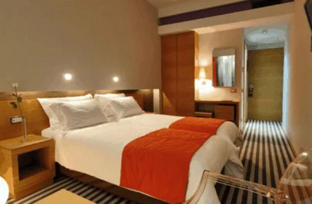 Bed in Galaxy City Center Hotel