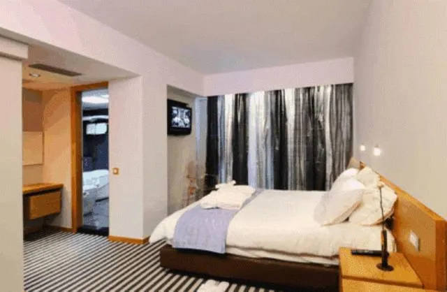 Bed in Galaxy City Center Hotel