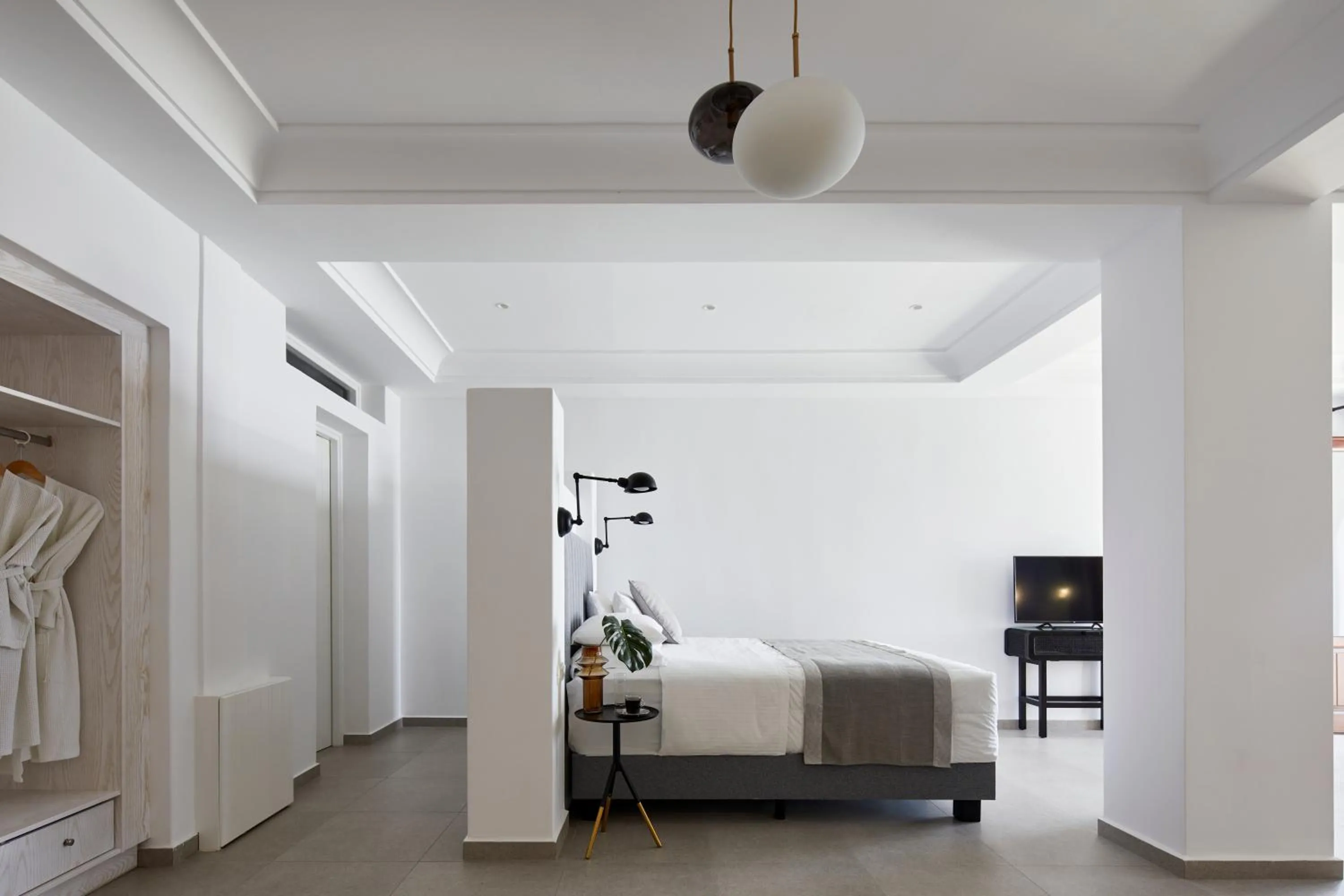 Bed in Petit Palace Suites