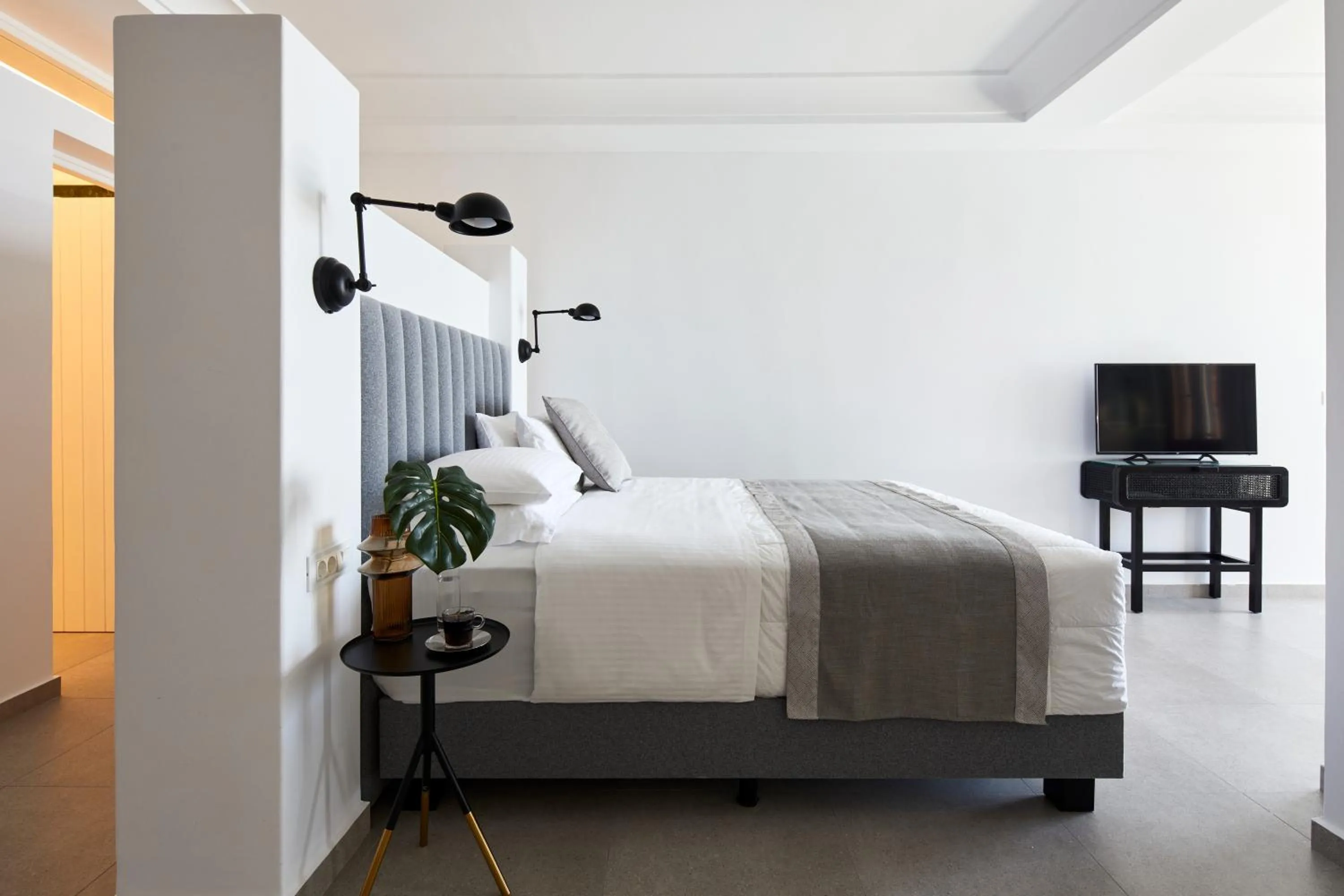 Bed in Petit Palace Suites