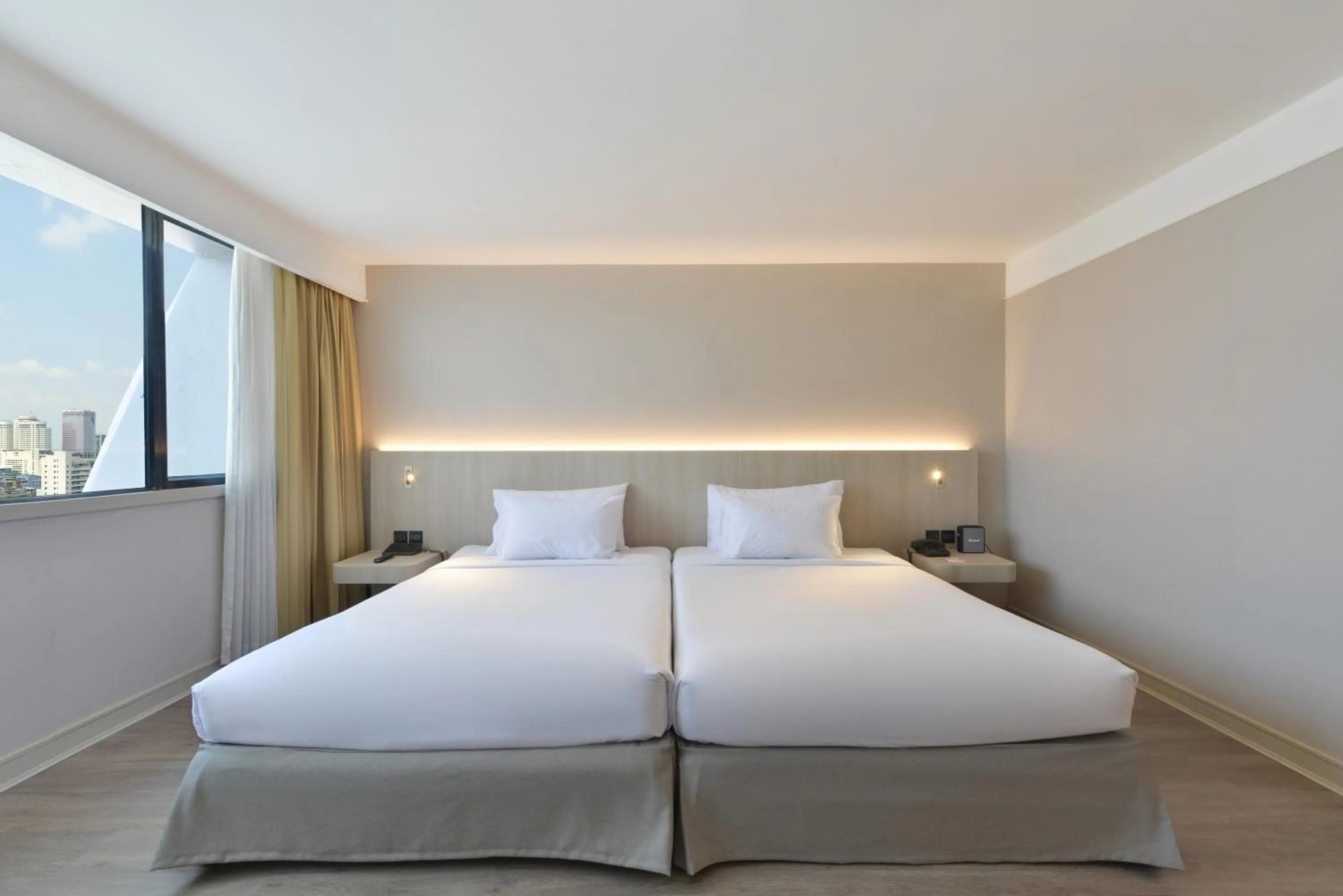 Bed in Twin Towers Hotel