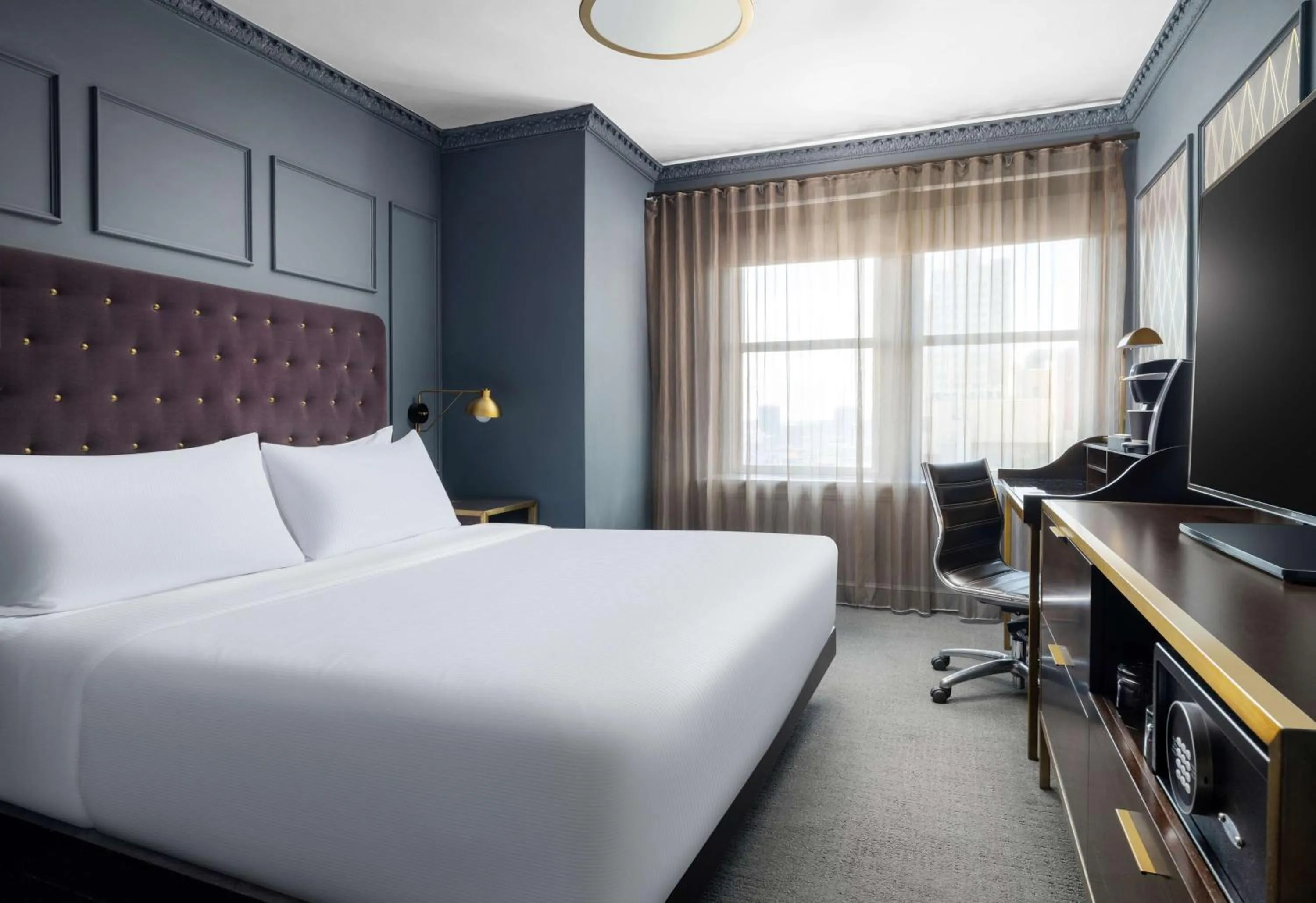 Bed in Hotel Phillips Kansas City, Curio Collection By Hilton