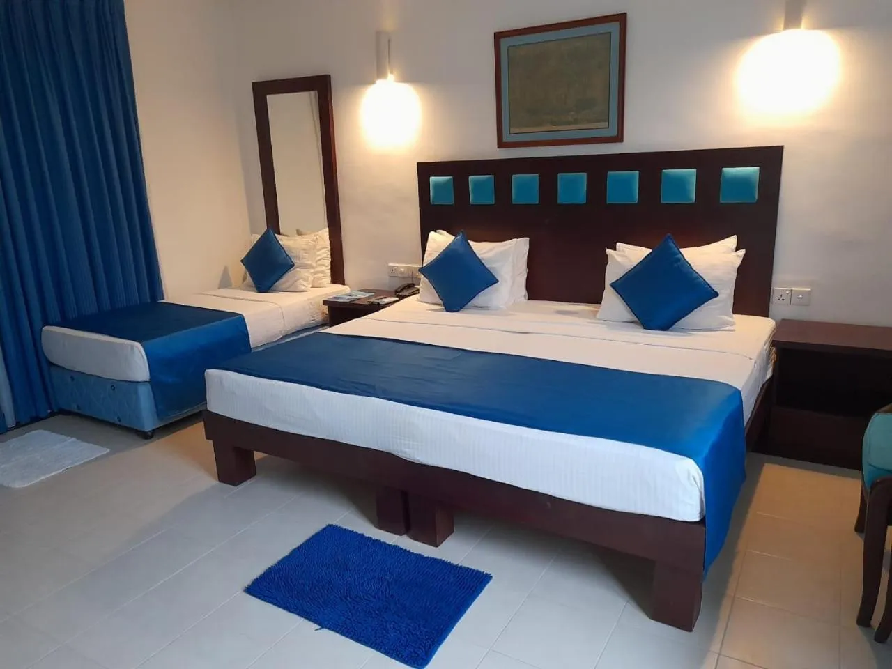 Photo of the whole room, Bed in Pigeon Island Beach Resort and Spa