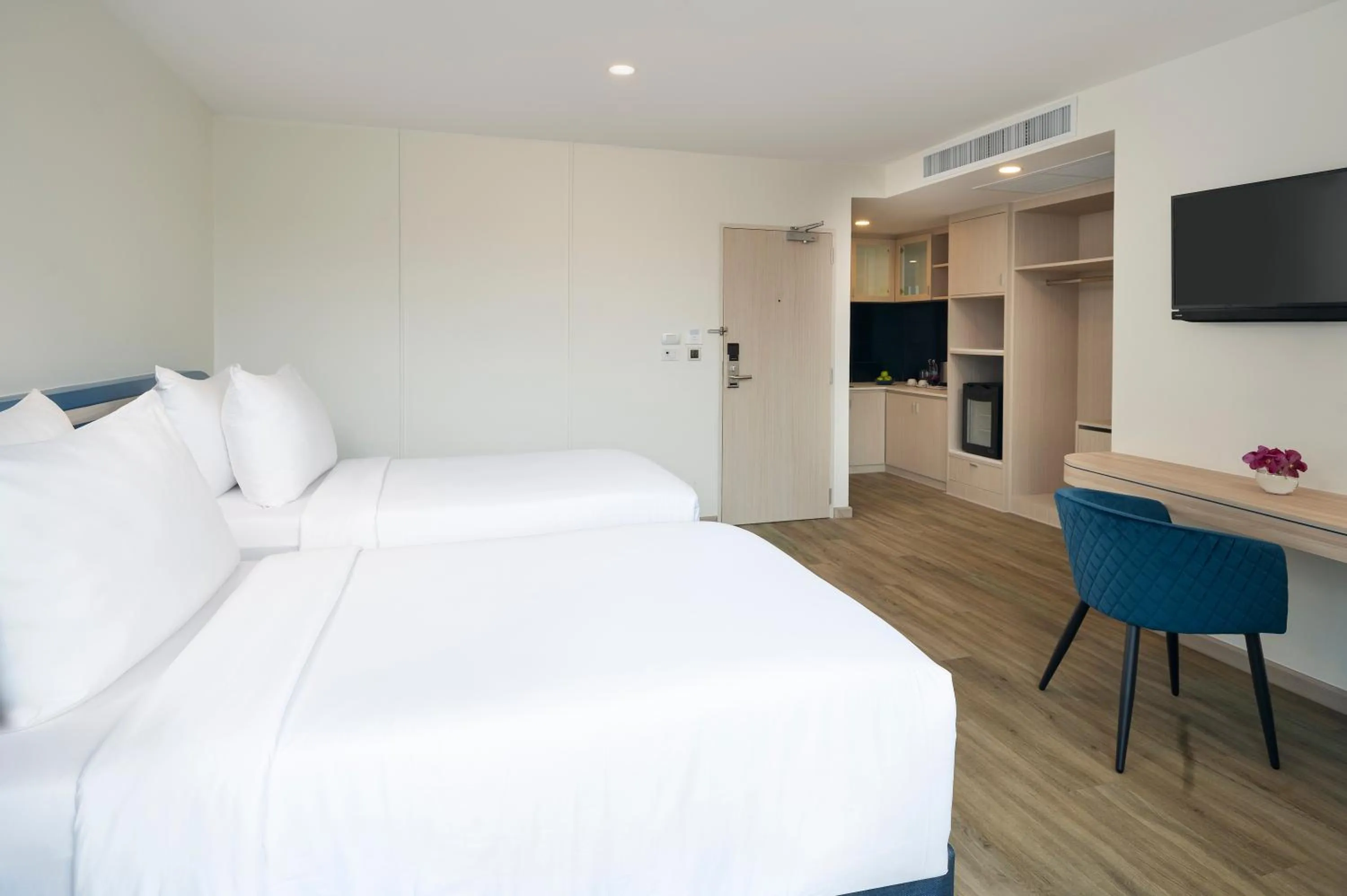 Bed in NH Boat Lagoon Phuket Resort