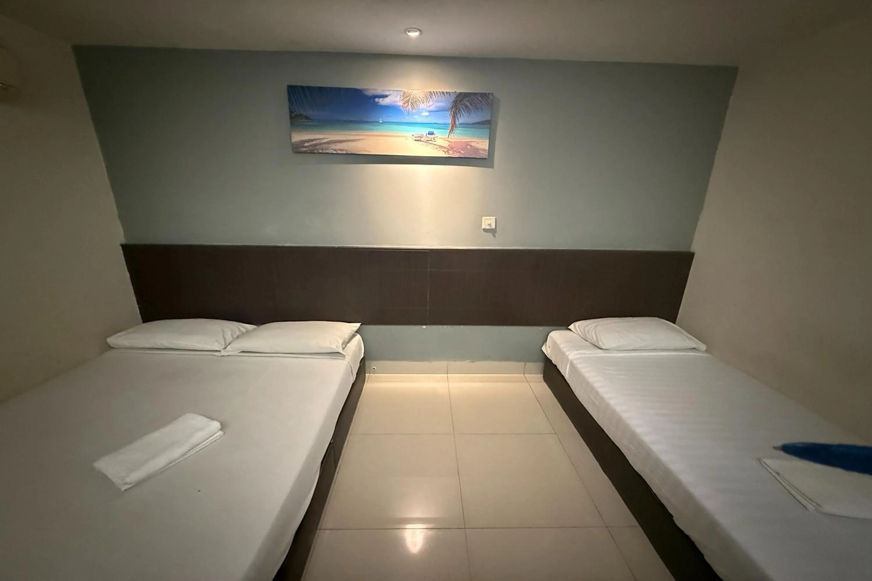 Bed in Tiong Nam Hotel