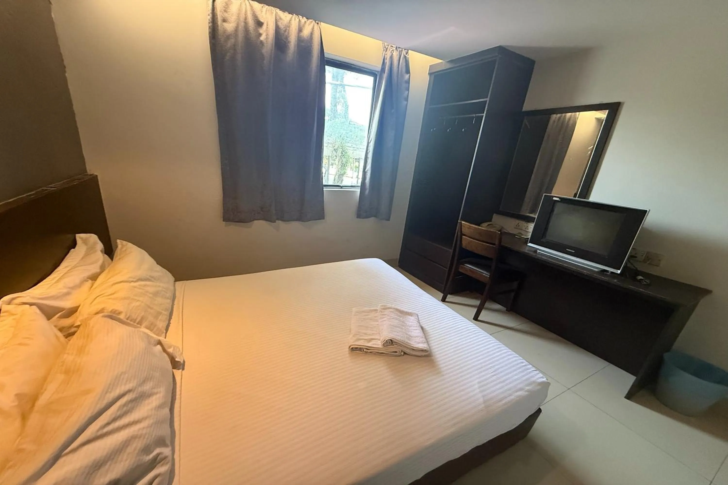 Bed in Tiong Nam Hotel