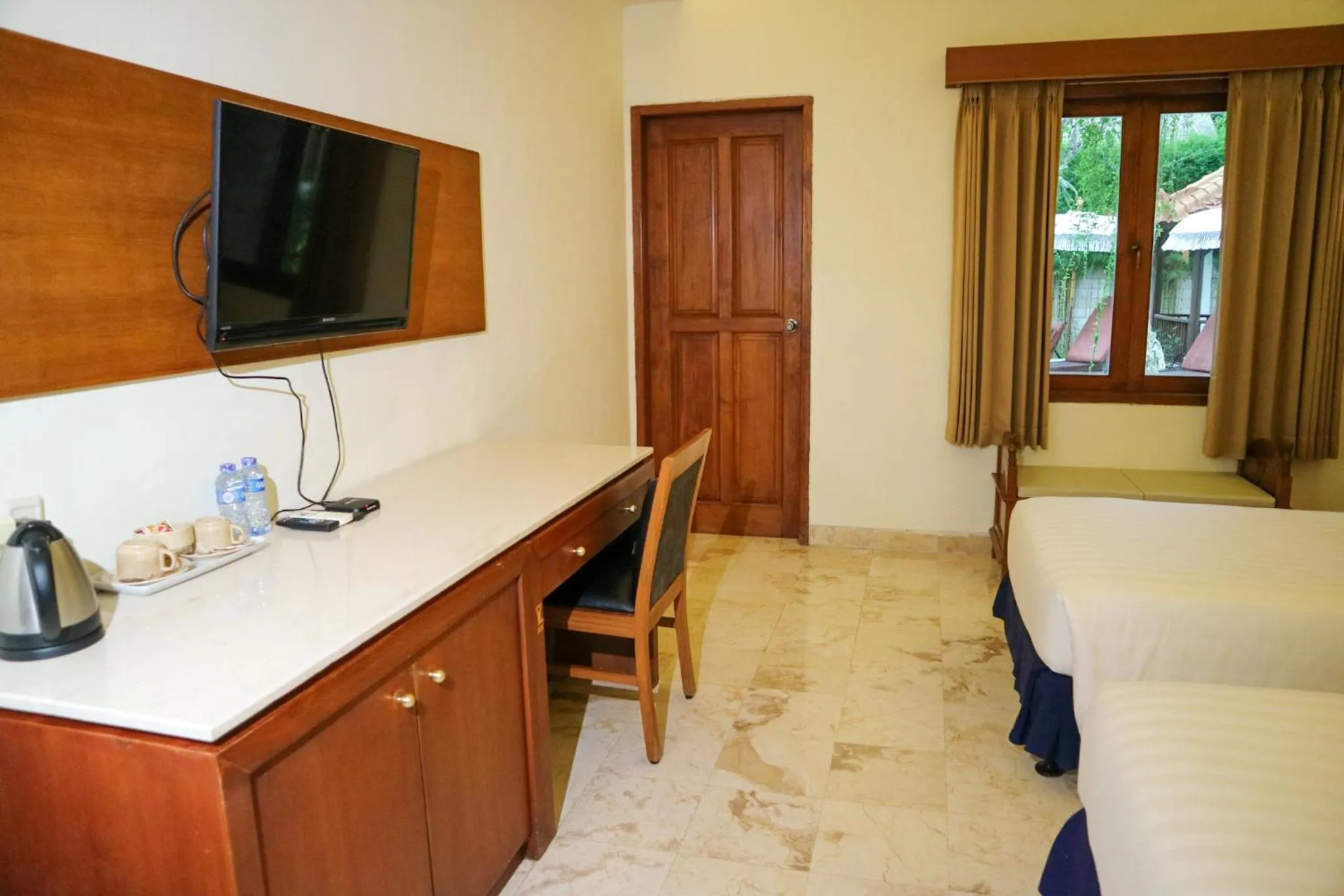 Bed in The Lagoon Bali Pool Hotel and Suites