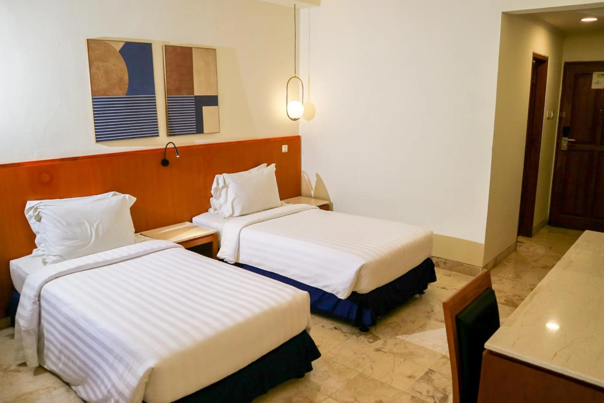 Bed in The Lagoon Bali Pool Hotel and Suites