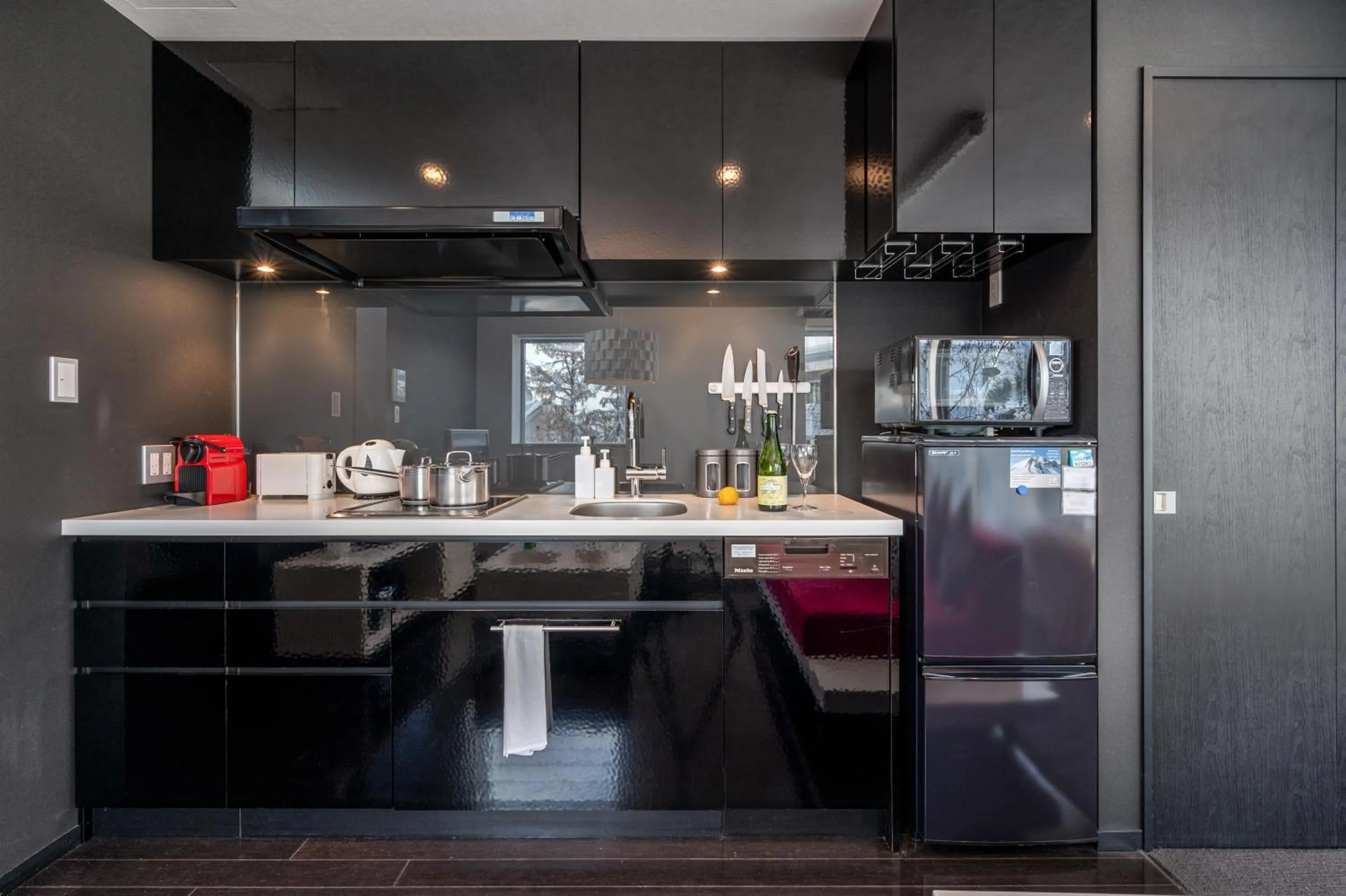 Kitchen or kitchenette in Kira Kira Suites by H2 Life