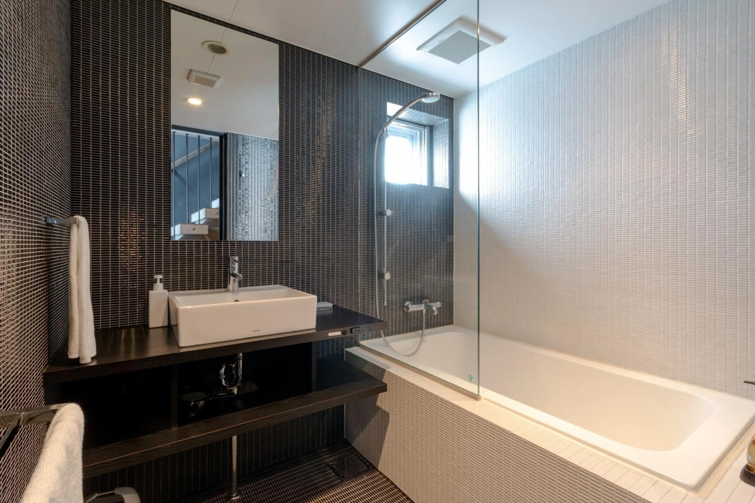 Bathroom in Kira Kira Suites by H2 Life