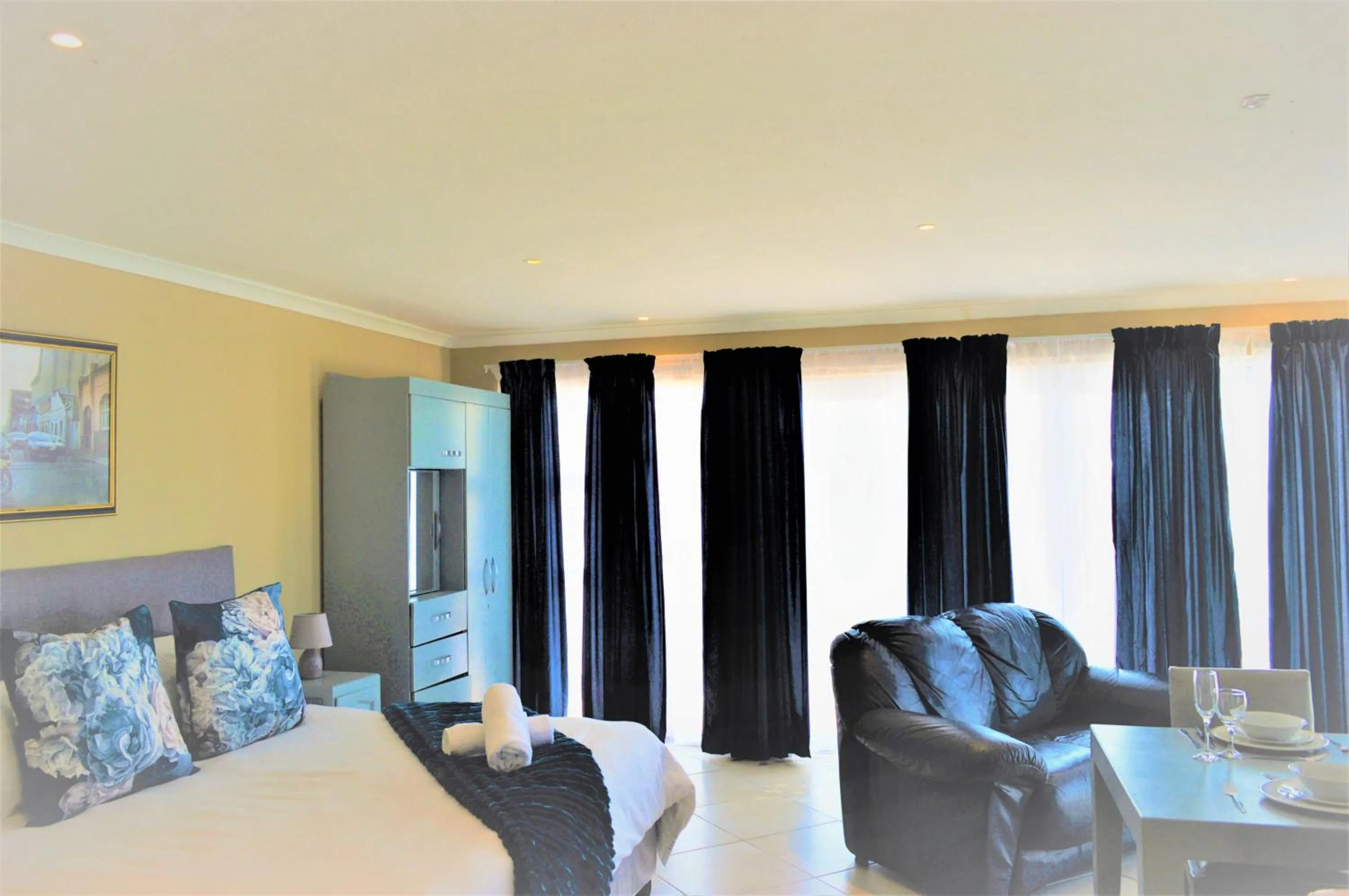 Seating area, Bed in Point Village Hotel and Self Catering