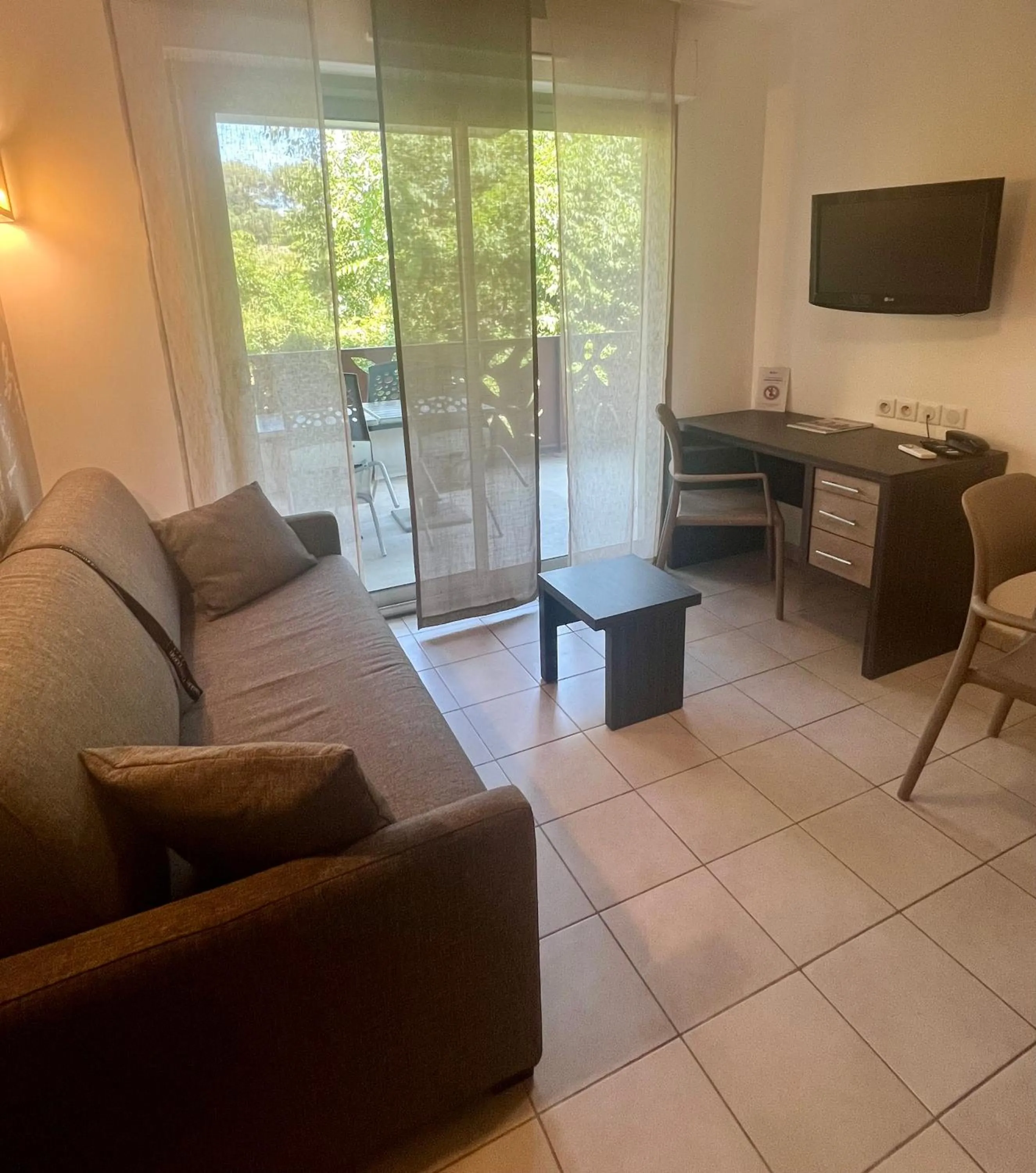 Living room in Lagrange Aparthotel Montpellier Millénaire