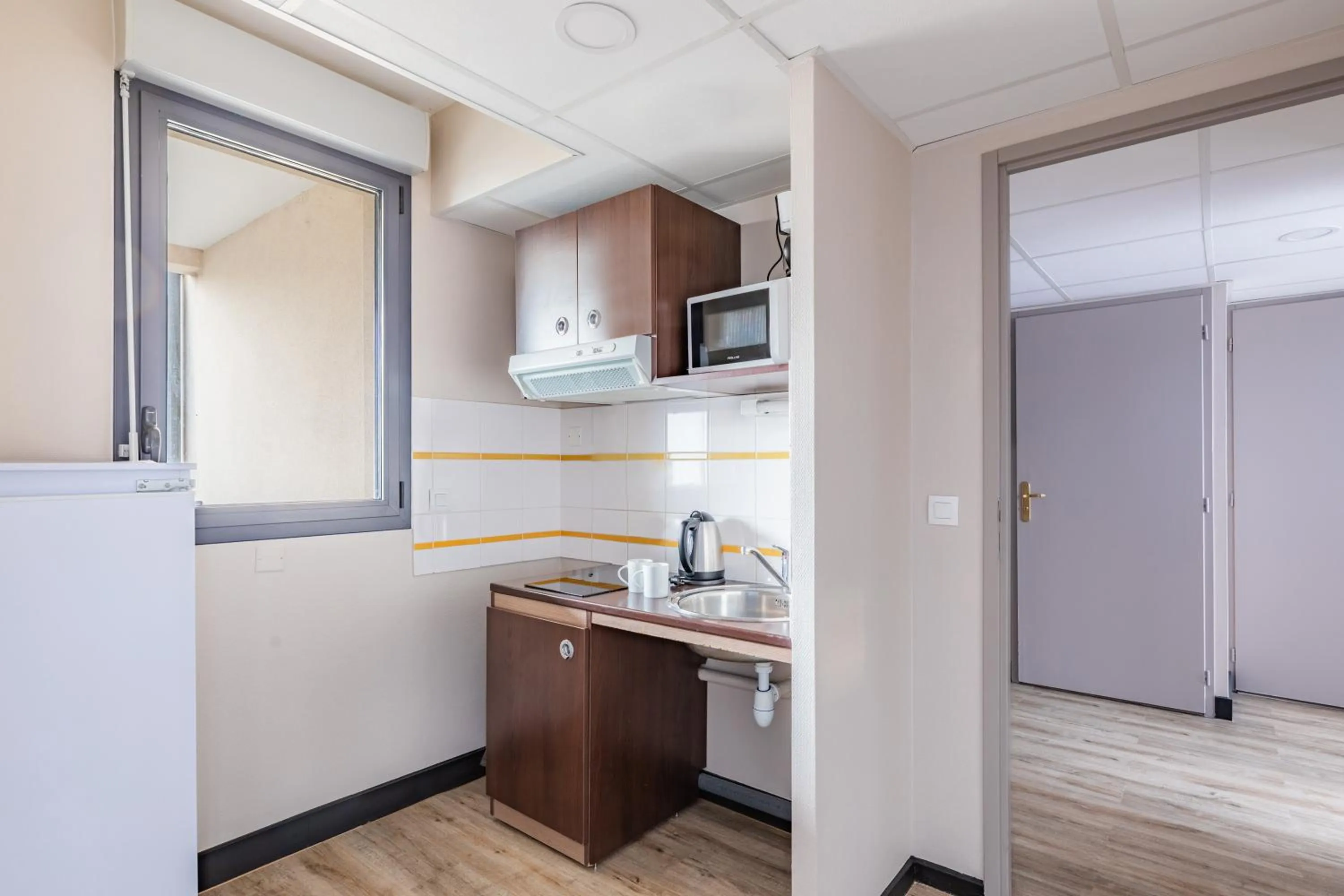 Kitchen or kitchenette in Appart'City Classic Montelimar