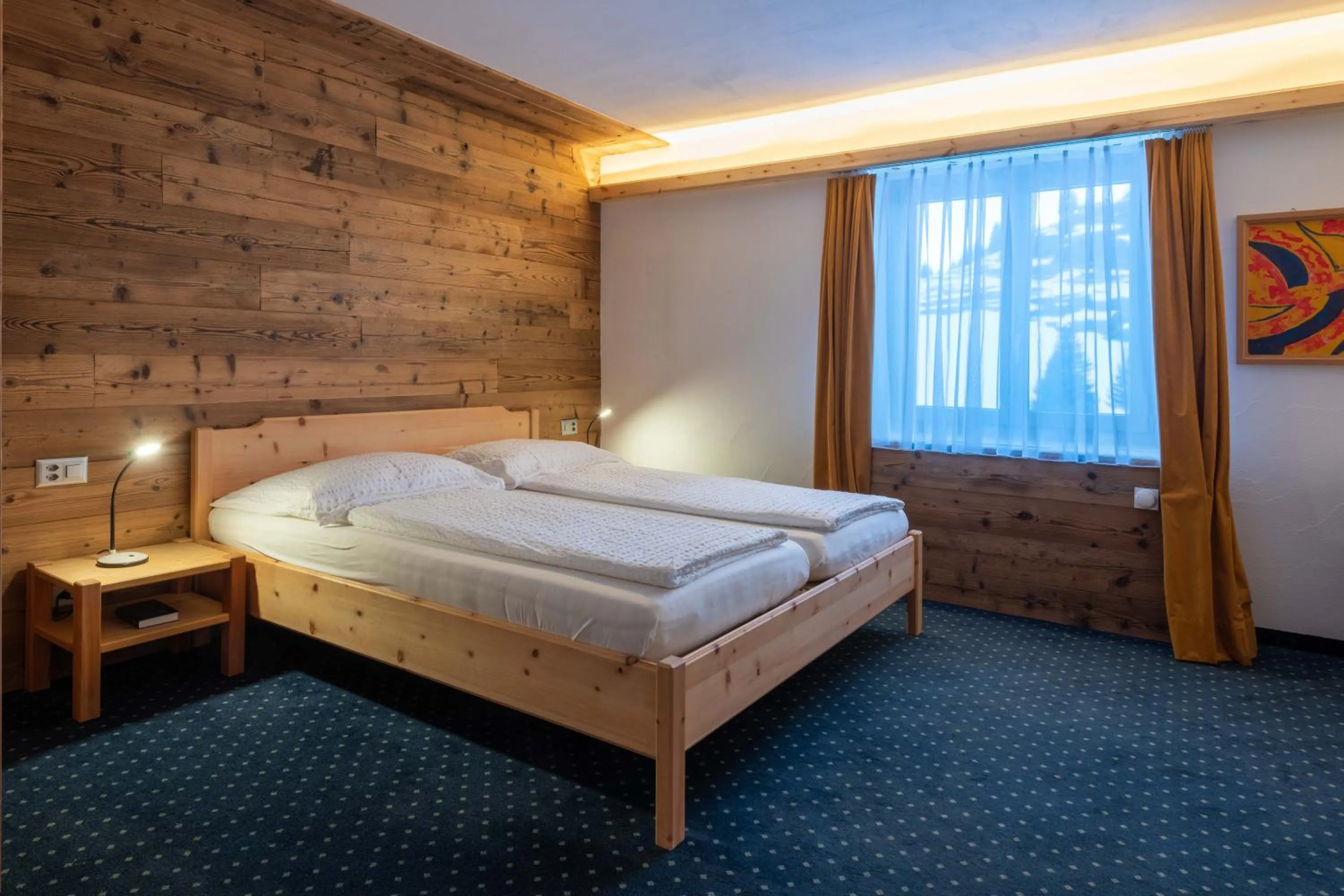 Bed in Hotel Grischuna