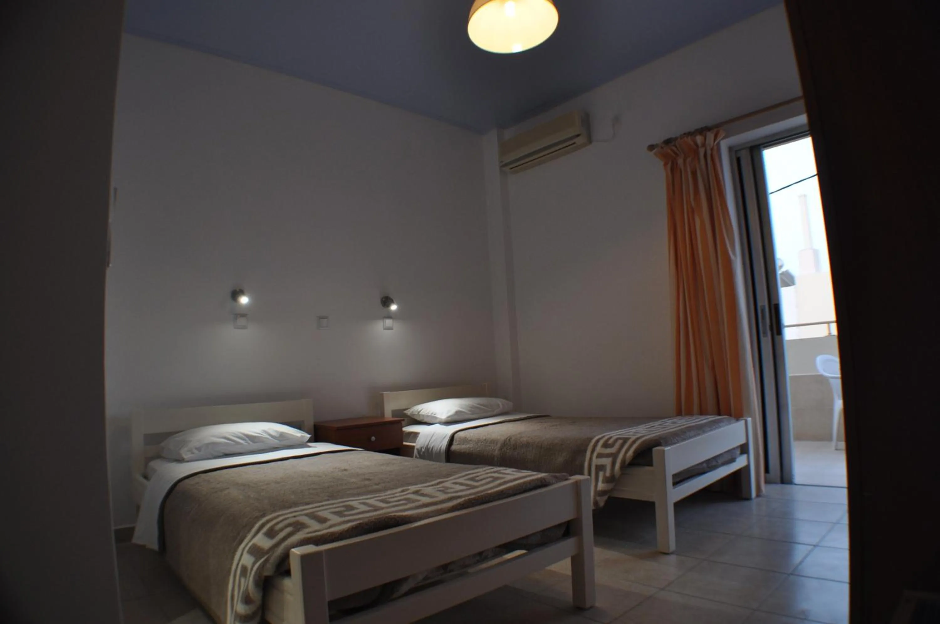 Bed in Zouboulia Apartments