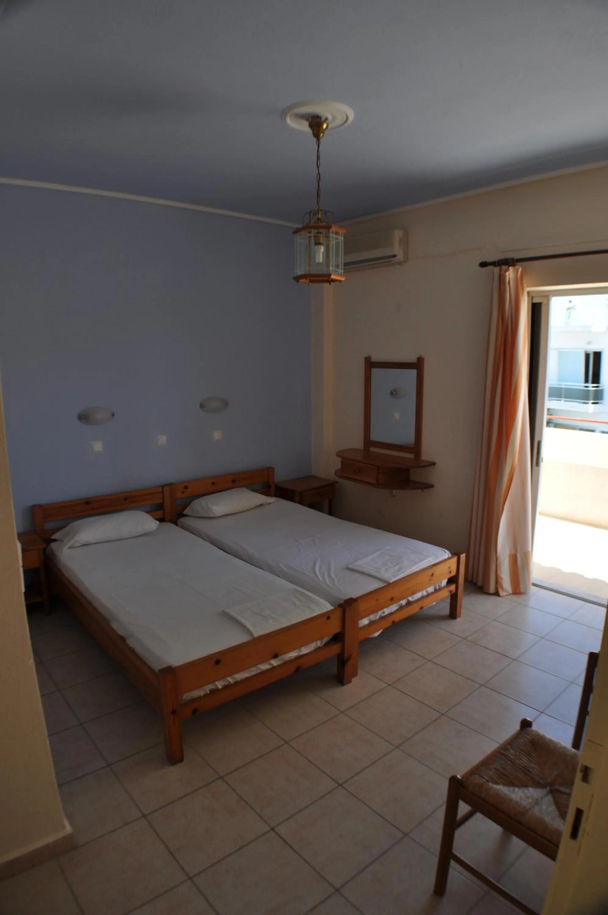 Bed in Zouboulia Apartments