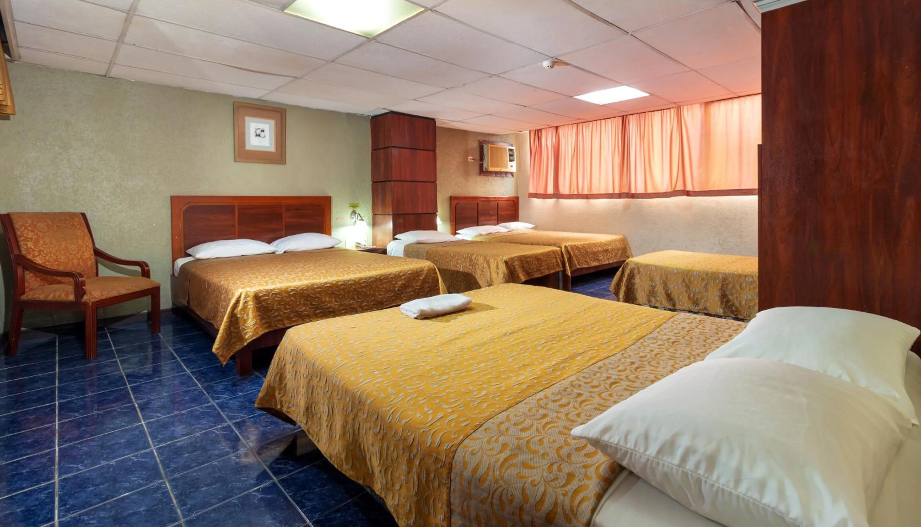 Photo of the whole room, Bed in Hotel Malecon Inn