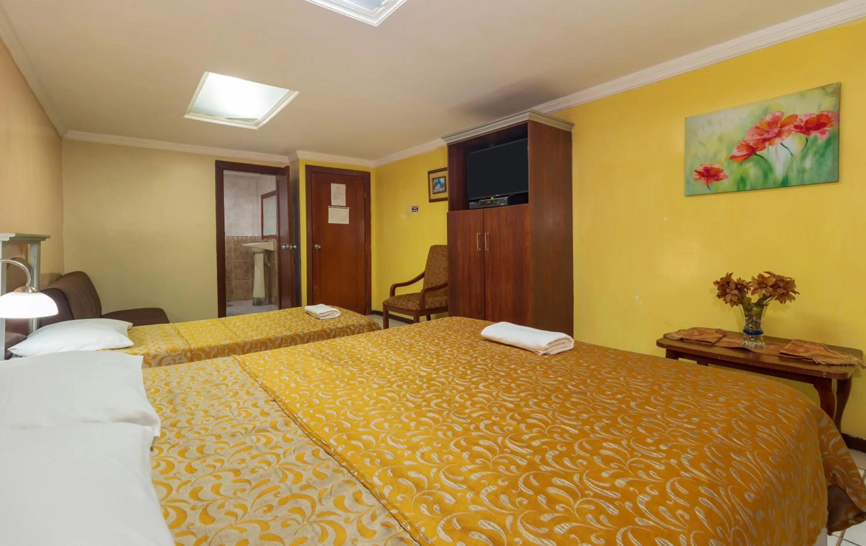 Bed in Hotel Malecon Inn