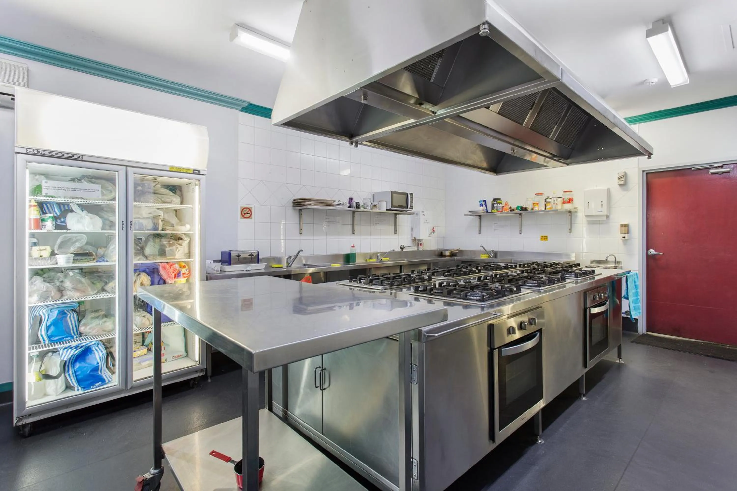 Communal kitchen in The Emperors Crown Hostel