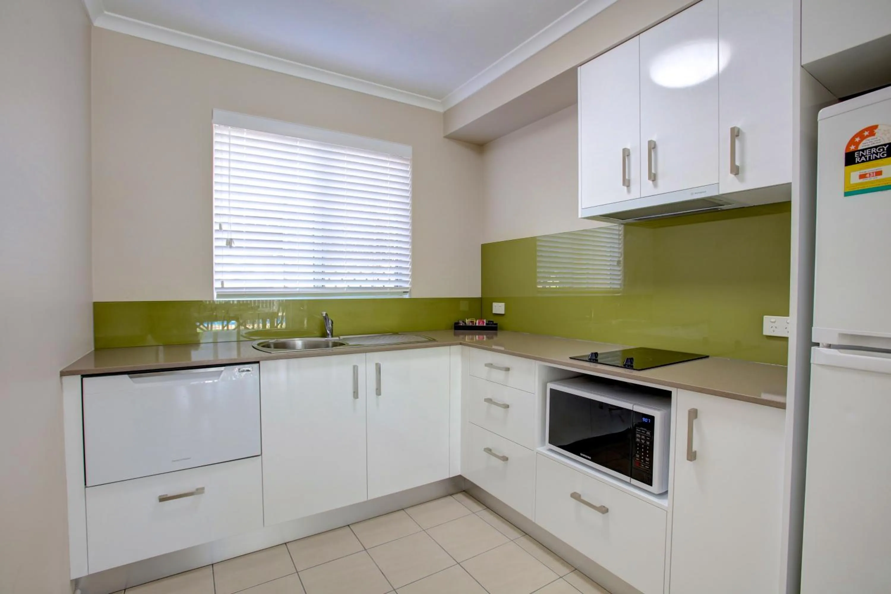 Kitchen or kitchenette in Beachpark Apartments Coffs Harbour