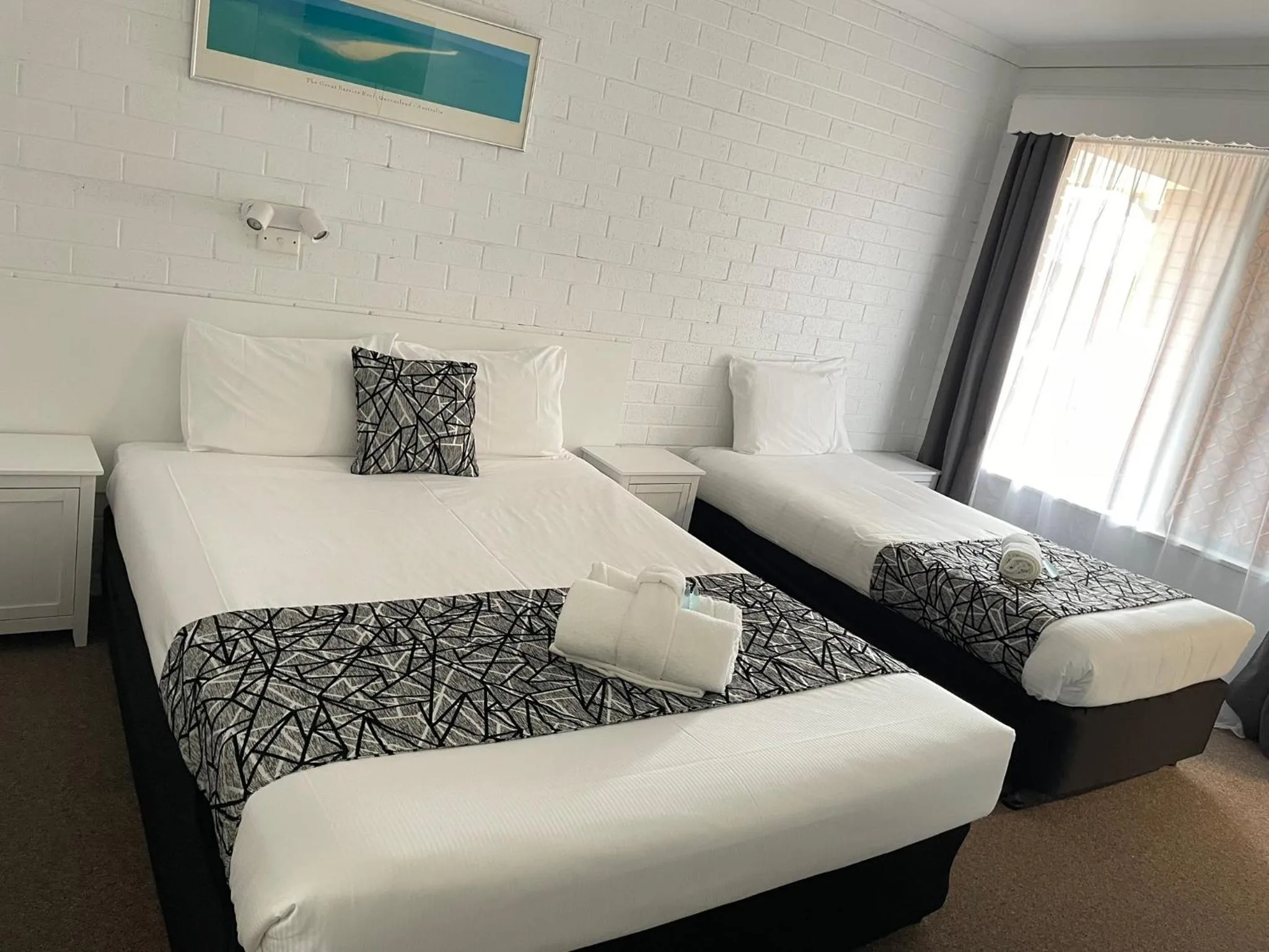 Bed in Coastal Bay Motel