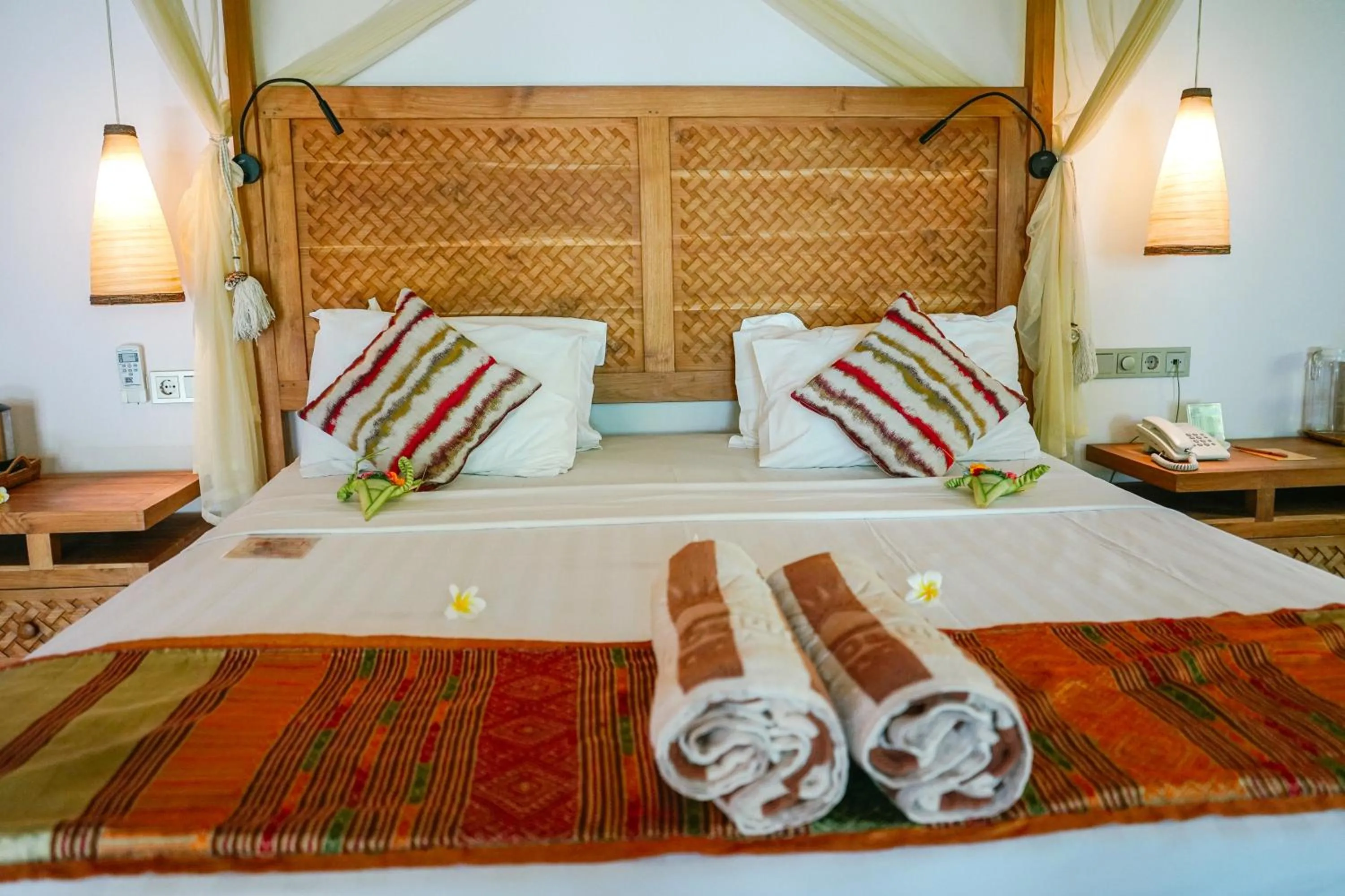 Bed in Puri Dajuma Beach Eco-Resort & Spa