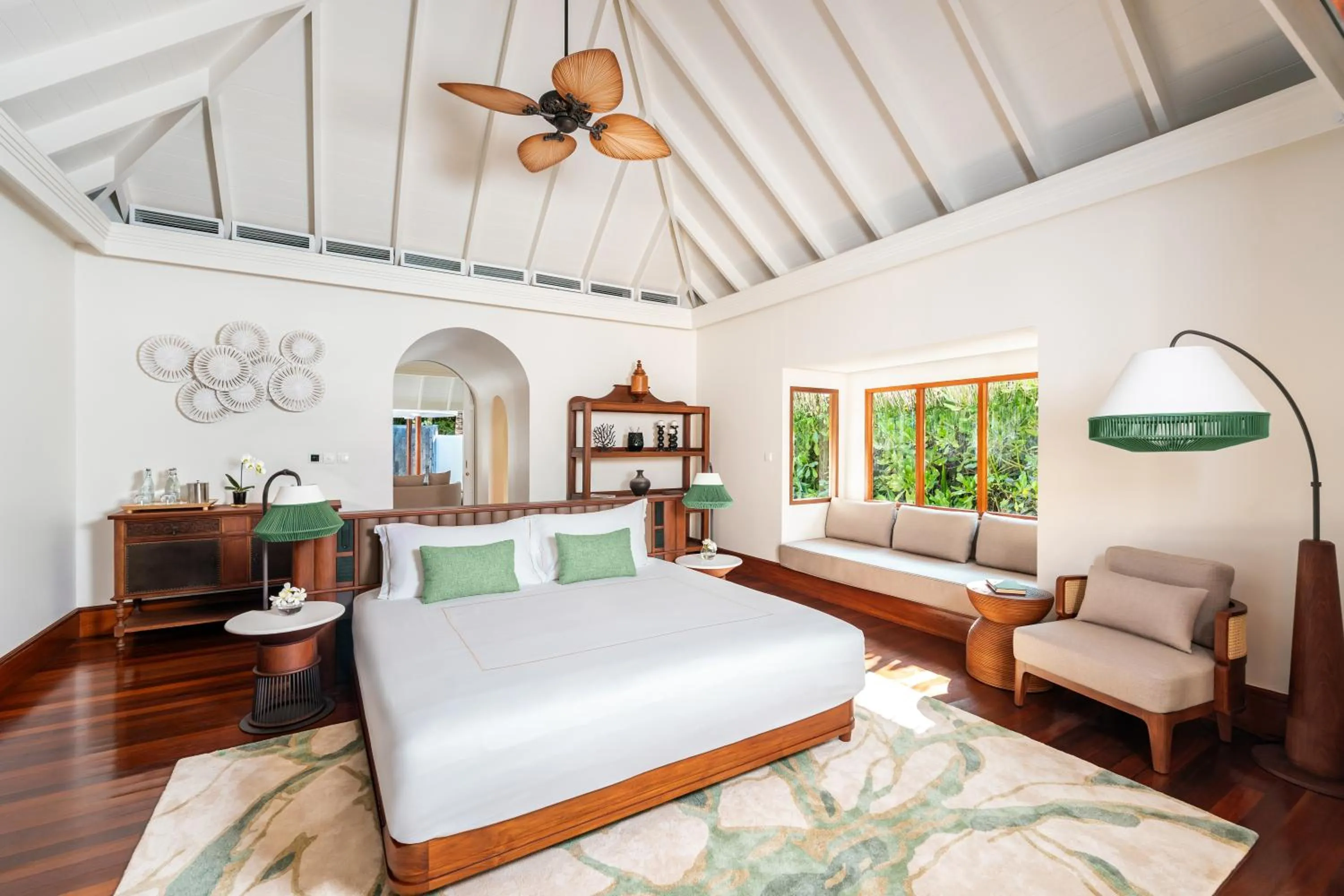Bed in Anantara Kihavah Maldives Villas