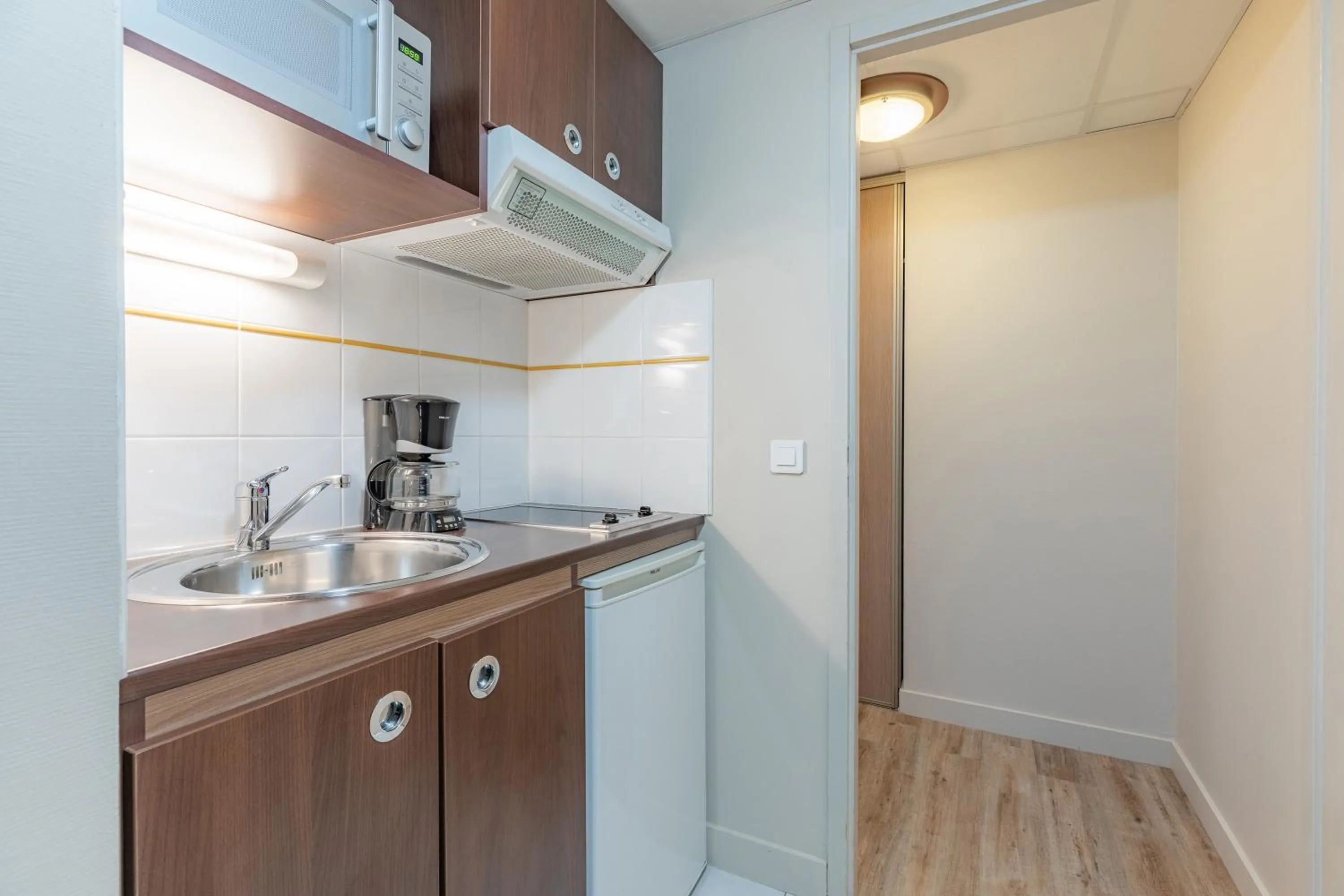 Kitchen or kitchenette in Appart'City Confort Agen Centre