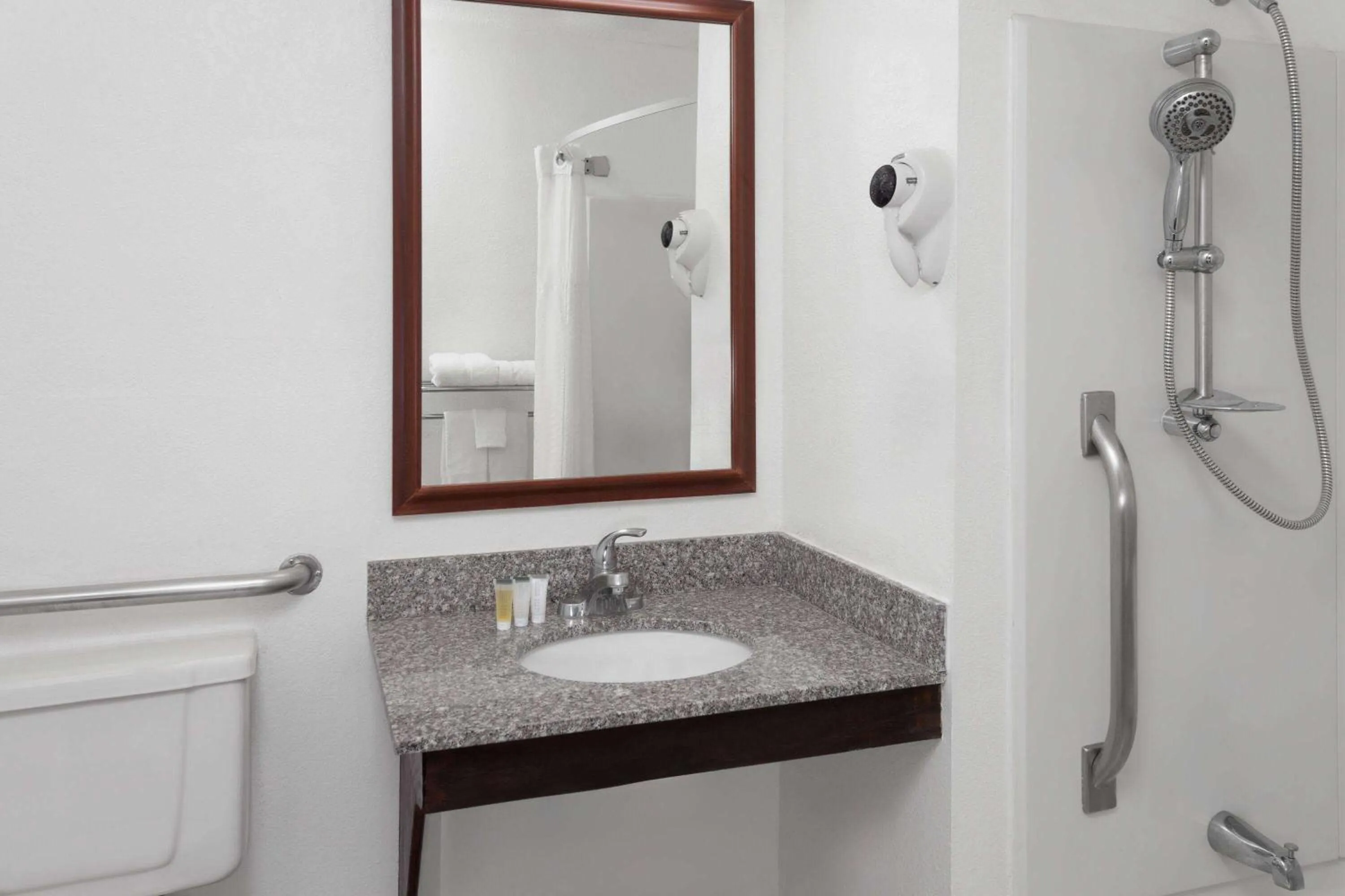 Bathroom in Super 8 by Wyndham Romeoville Bolingbrook