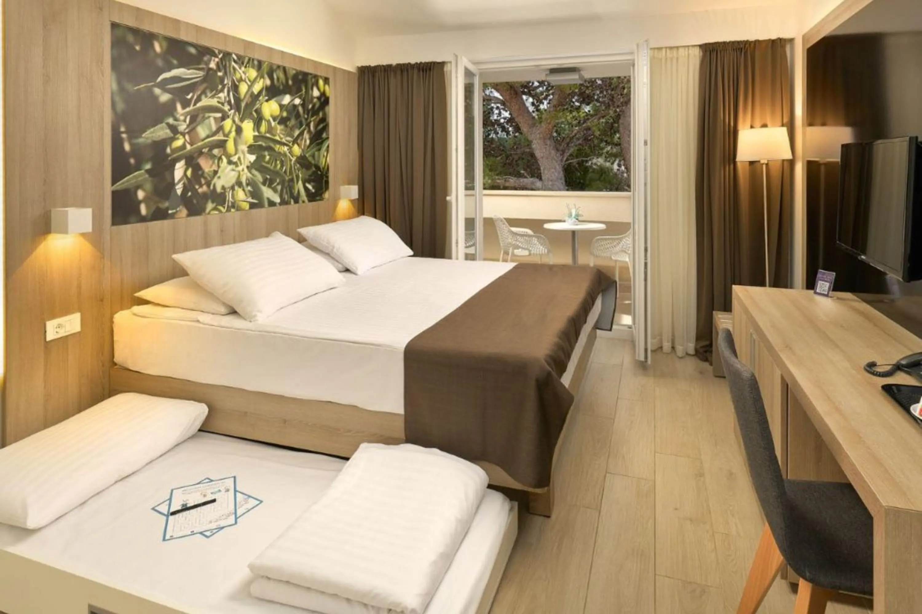 Bed in Medora Auri Family Beach Resort