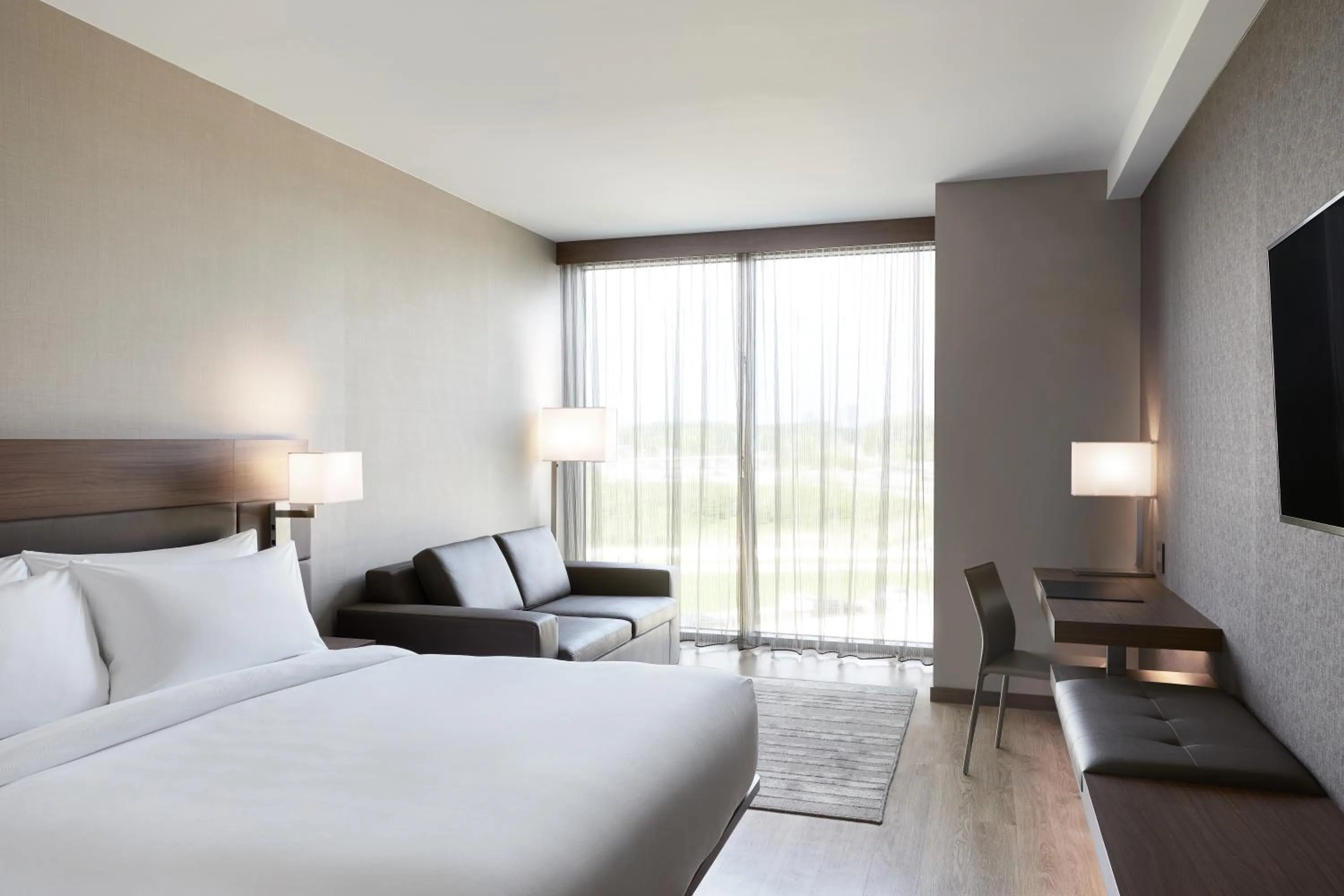 Bed in AC Hotel by Marriott Minneapolis West End