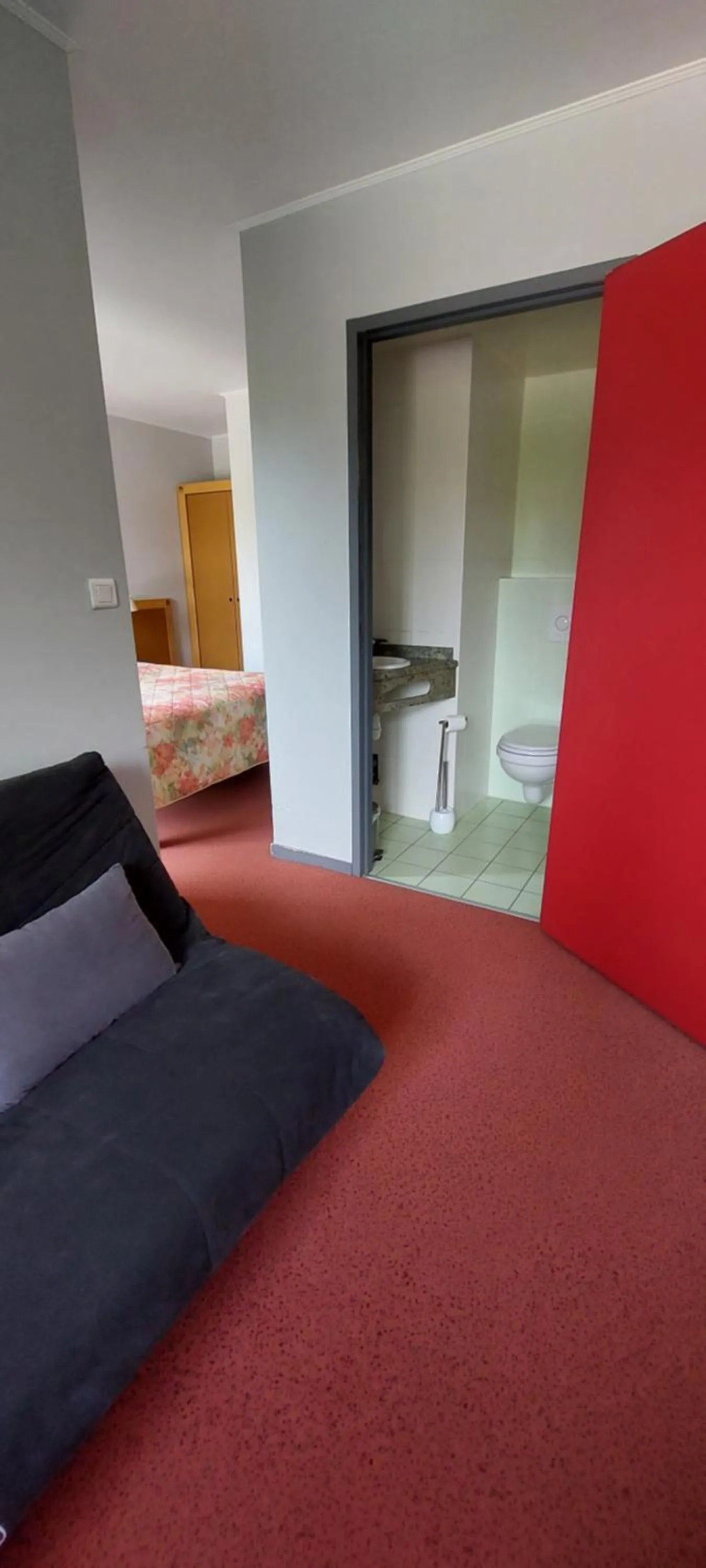 Bed in Logis Hotel Restaurant Le Cygne