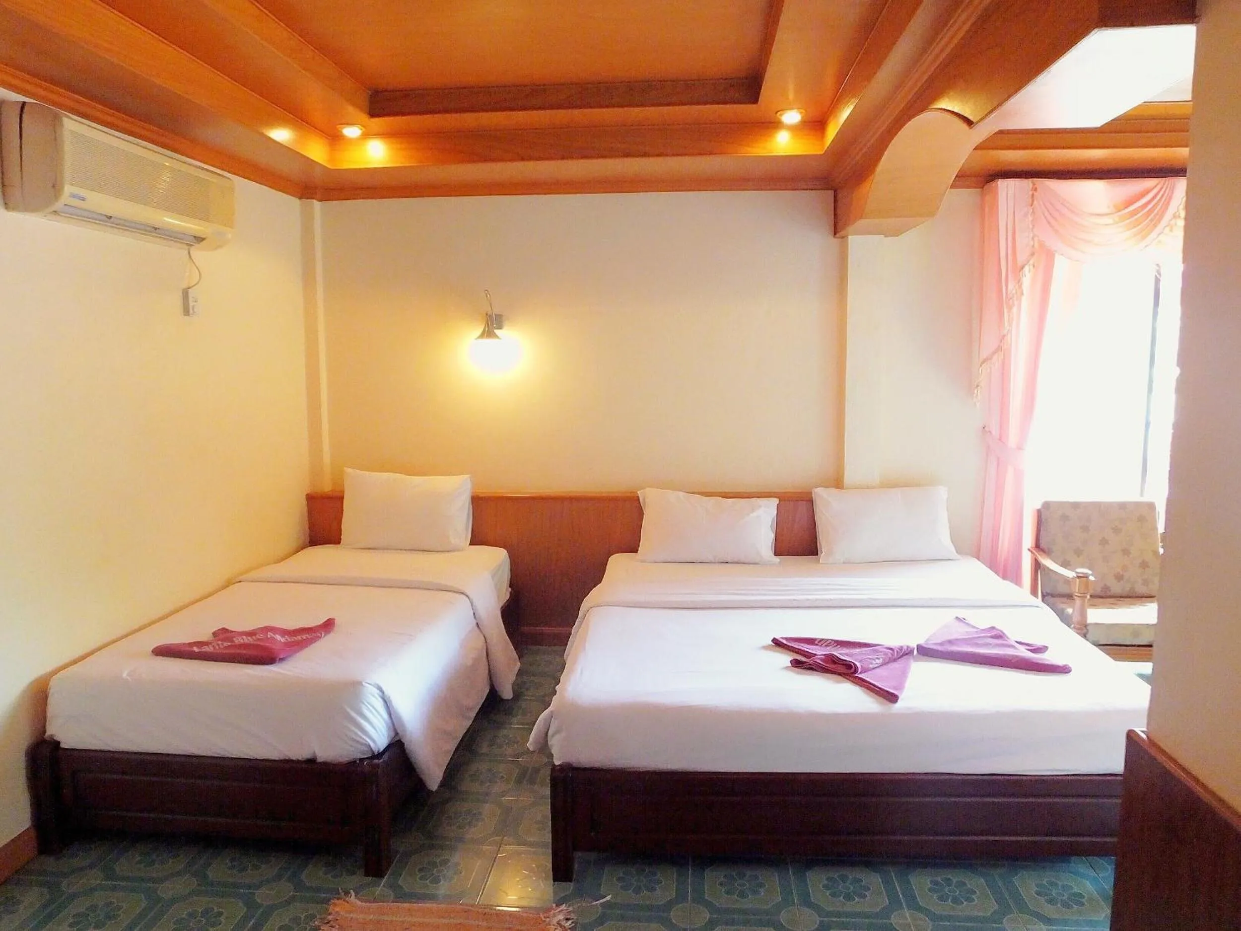 Bed in Blue Andaman Lanta Resort