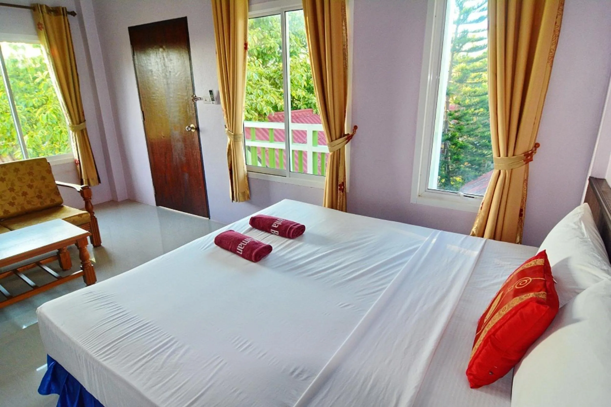 Bed in Blue Andaman Lanta Resort