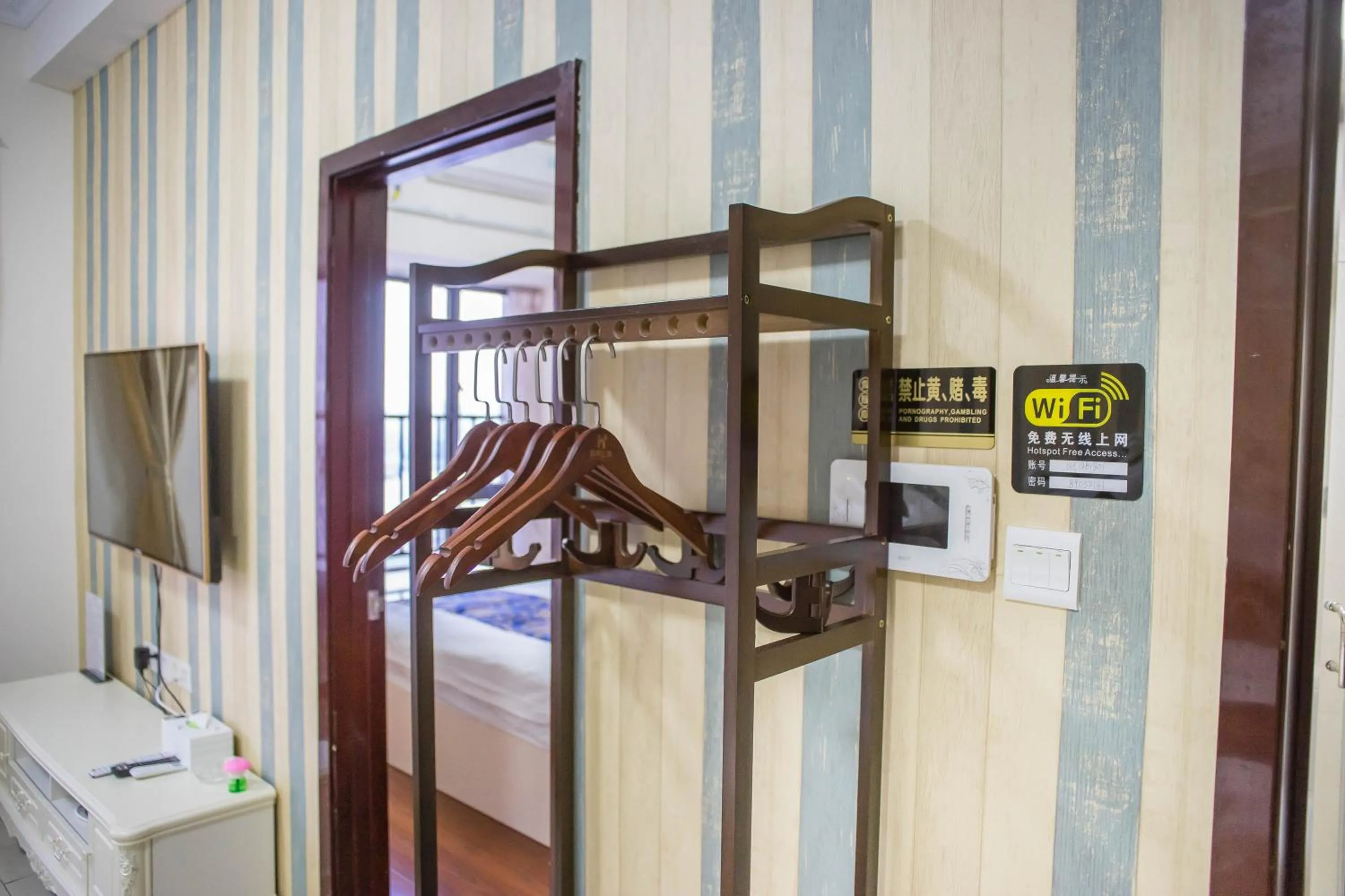 wardrobe, Bed in Xing Yu Legend Service Apartment Canton Fair Branch