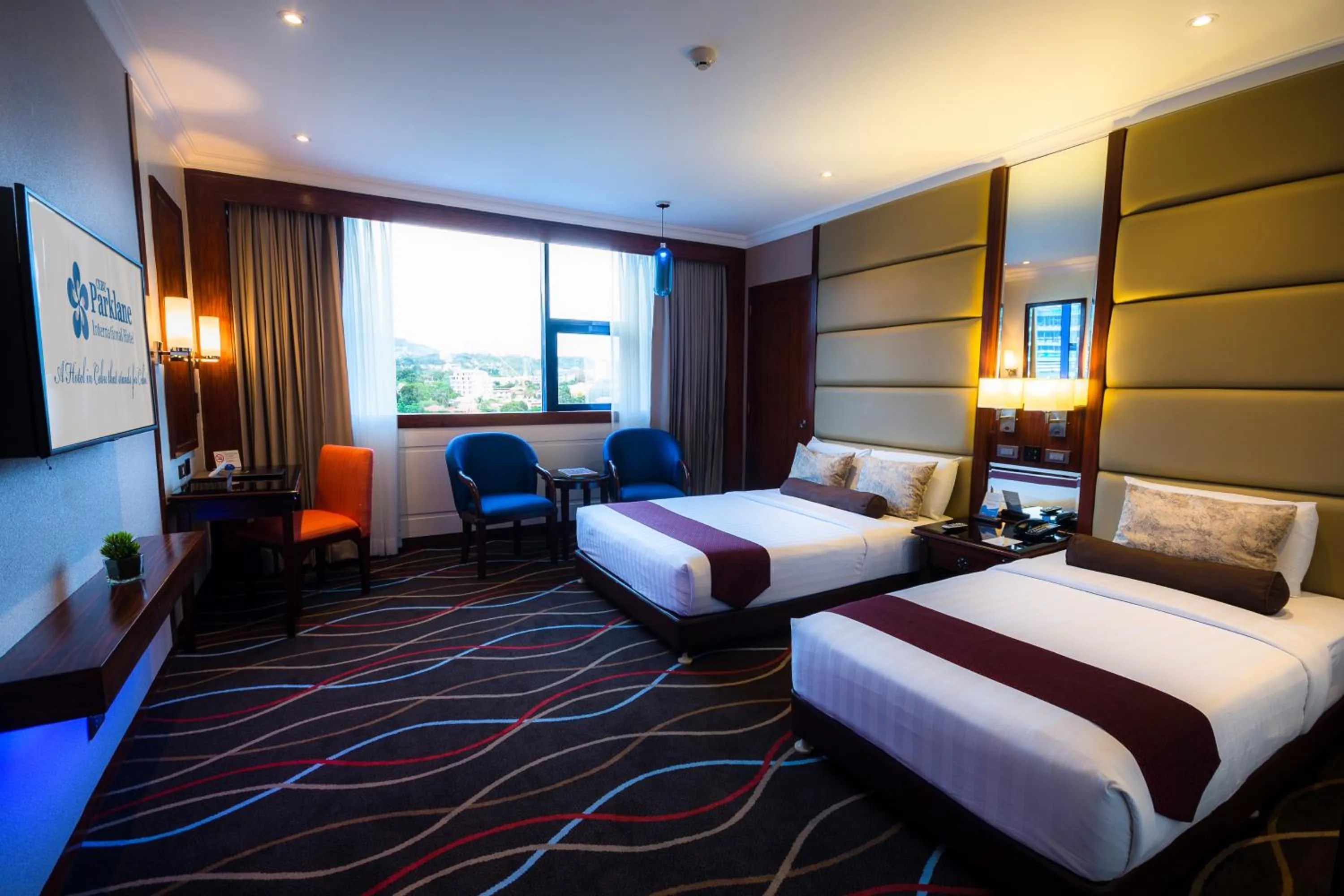 Photo of the whole room, Bed in Cebu Parklane International Hotel