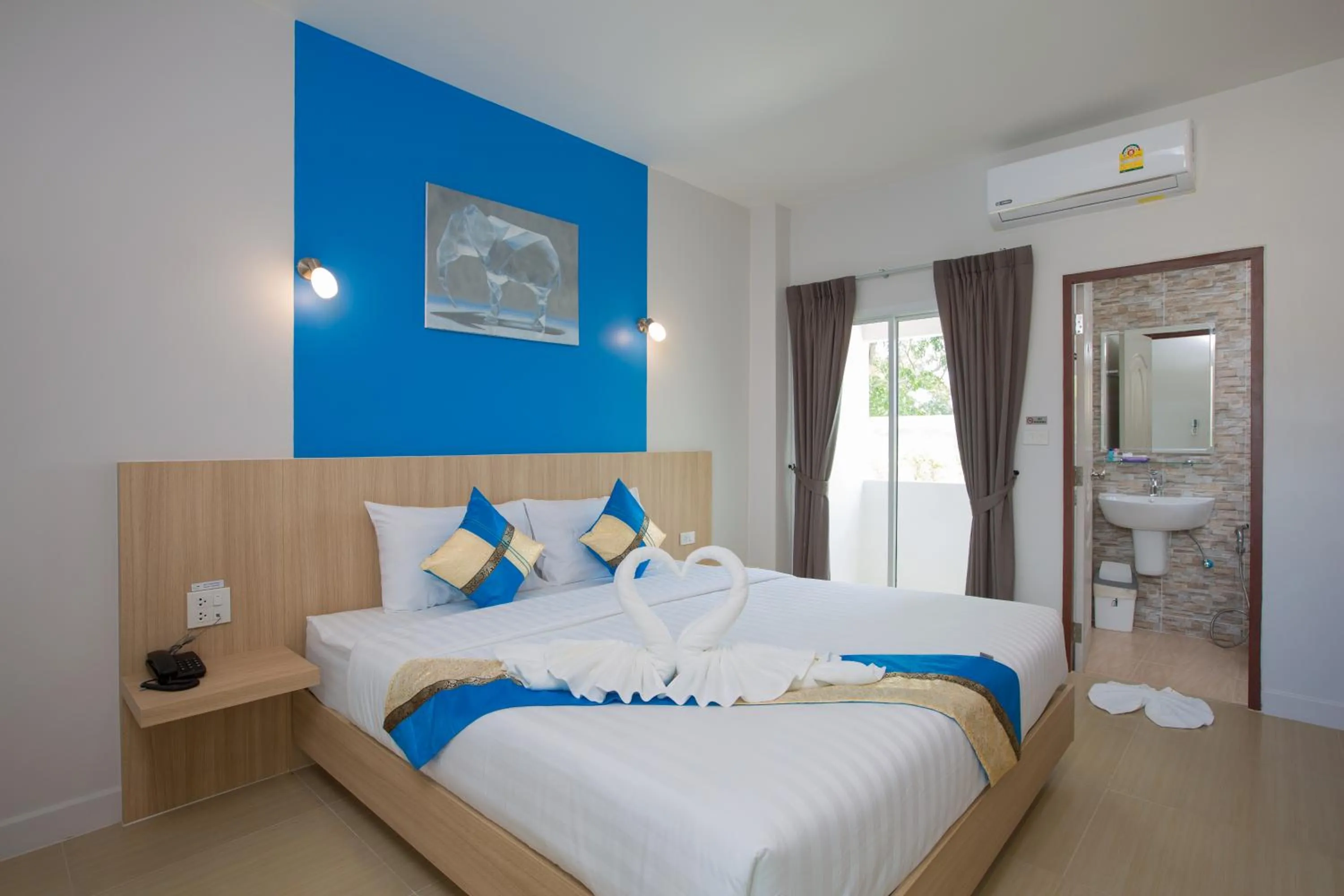 Bed in Phant at Thalang Service Apartment