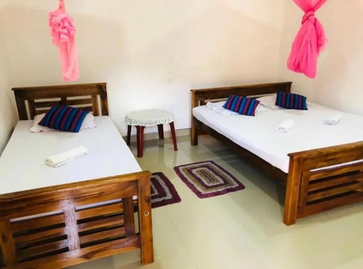 Bed in Kumari Guest House