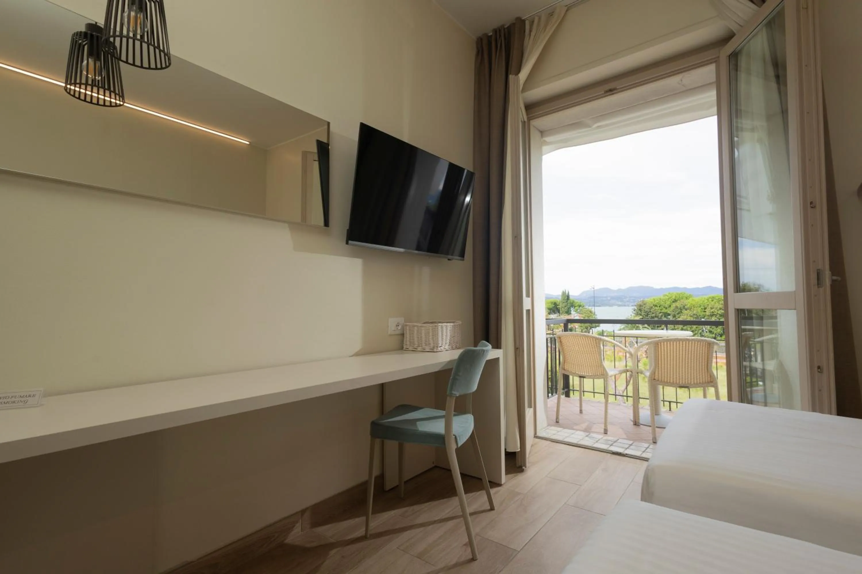 Communal lounge/ TV room, Bed in Hotel Berta