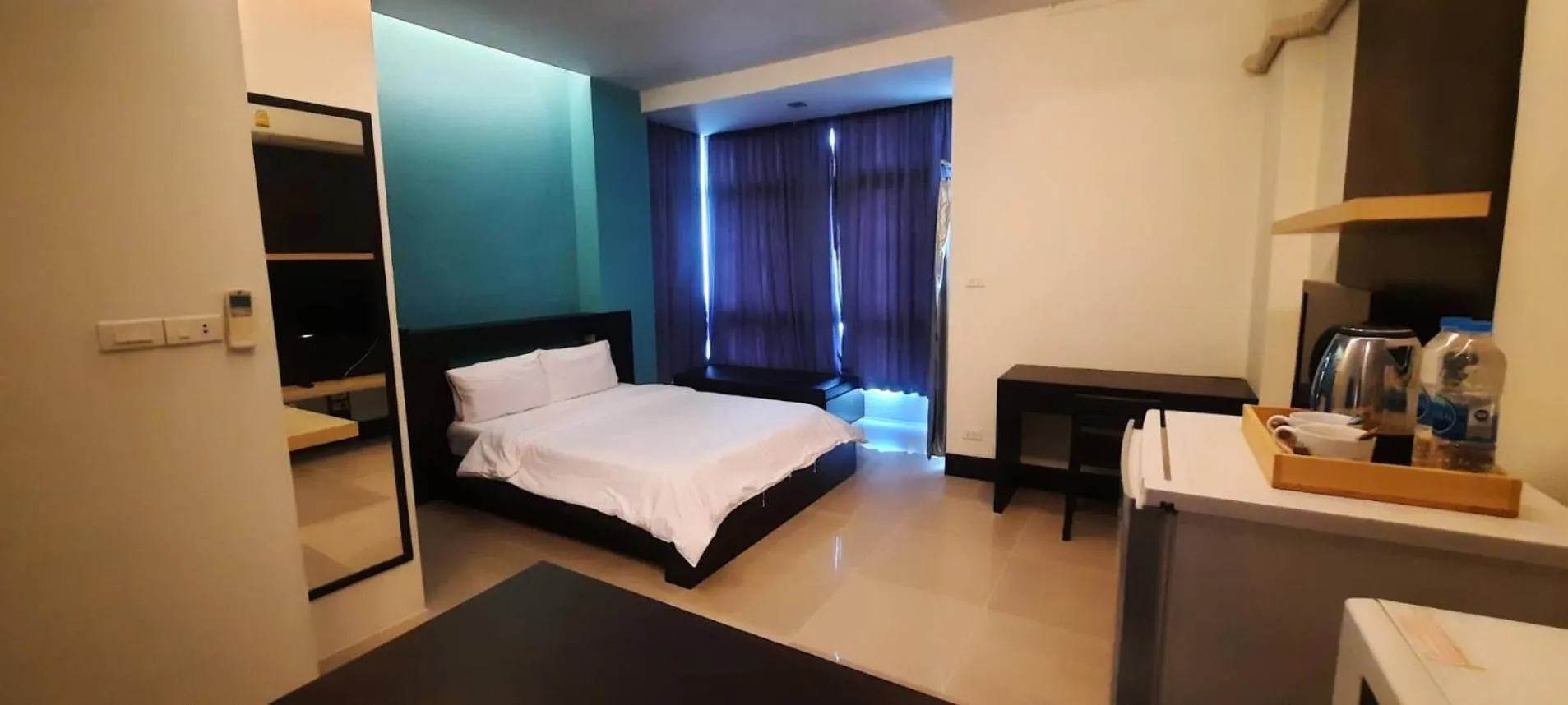 Photo of the whole room, Bed in @Home Residence