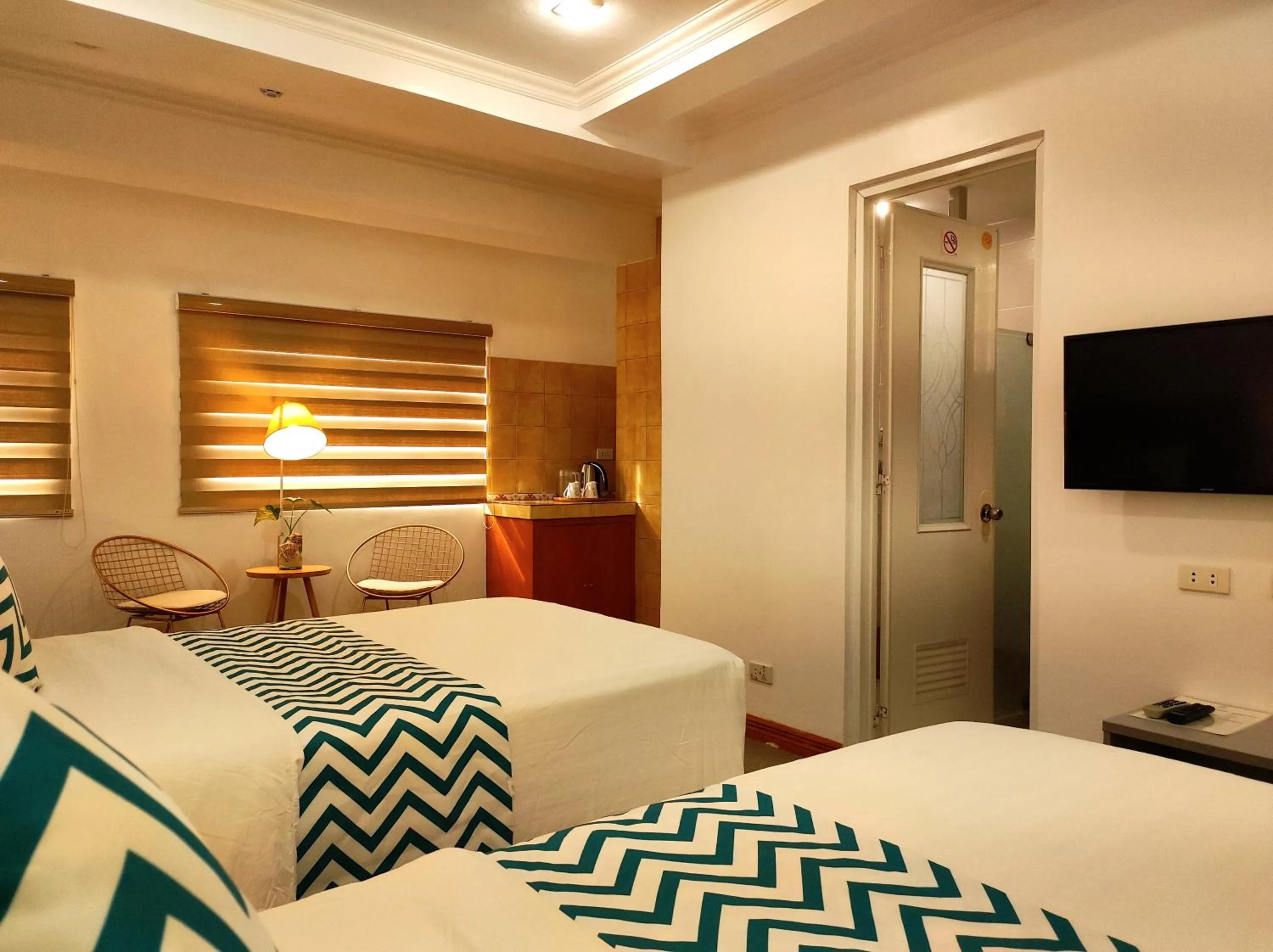 Bed in Grand Blue Beach Hotel