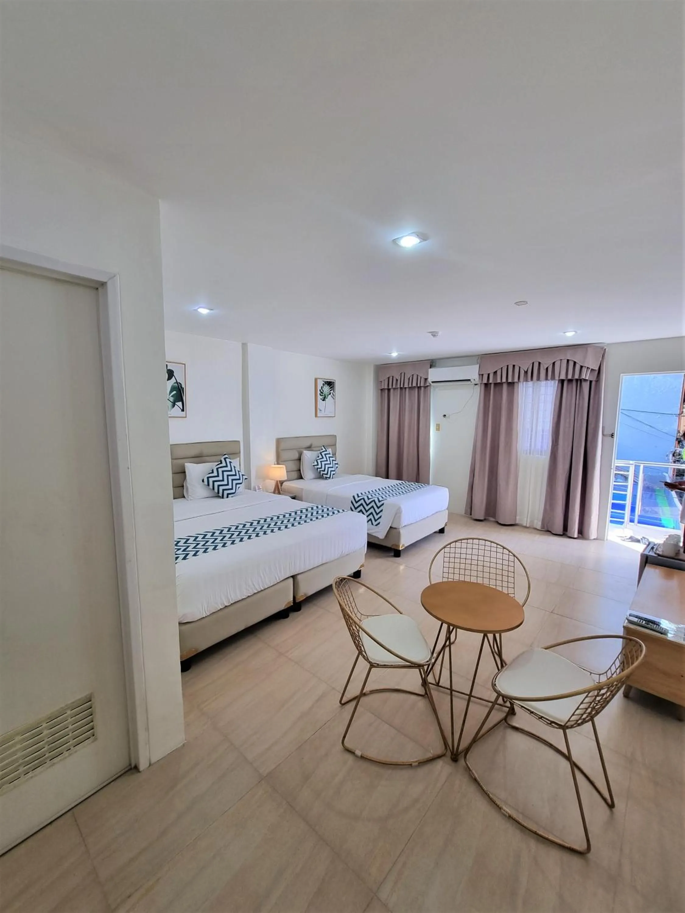 Bed in Grand Blue Beach Hotel