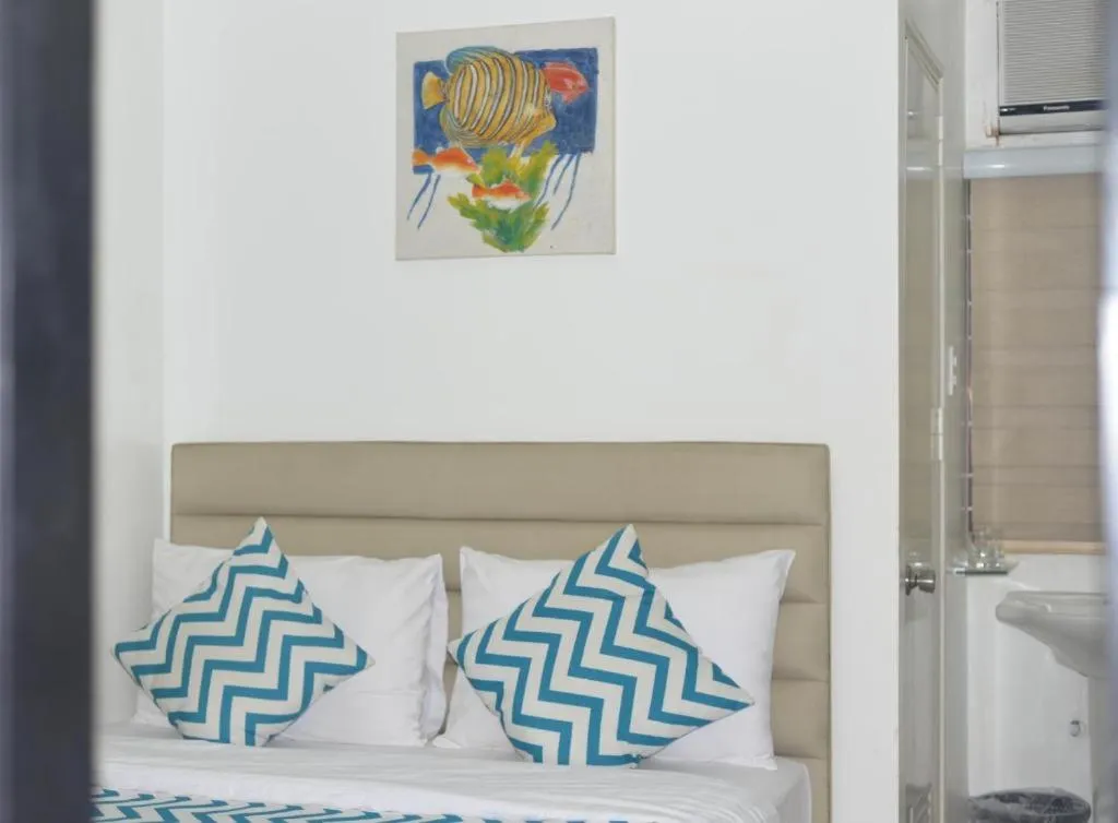 Bed in Grand Blue Beach Hotel