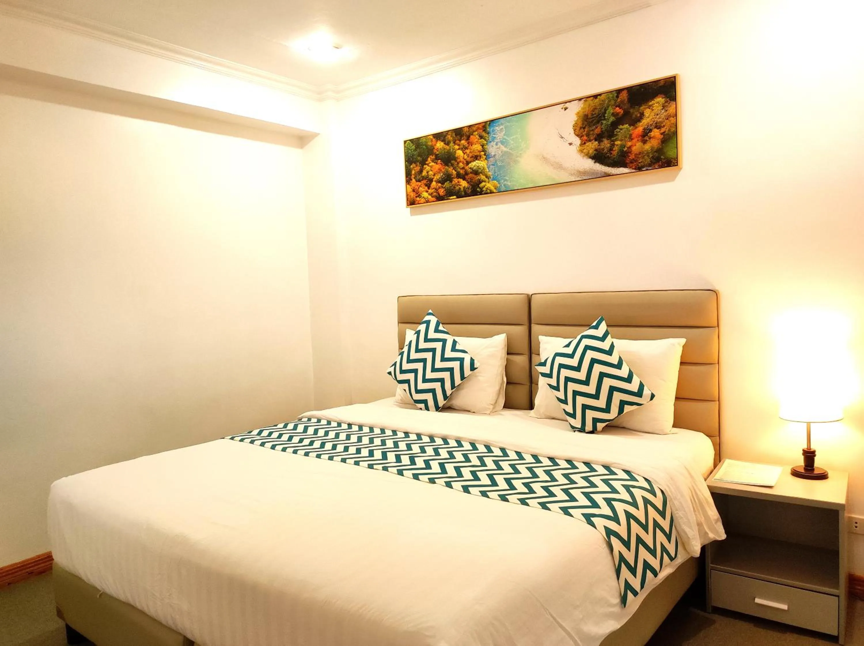 Bed in Grand Blue Beach Hotel