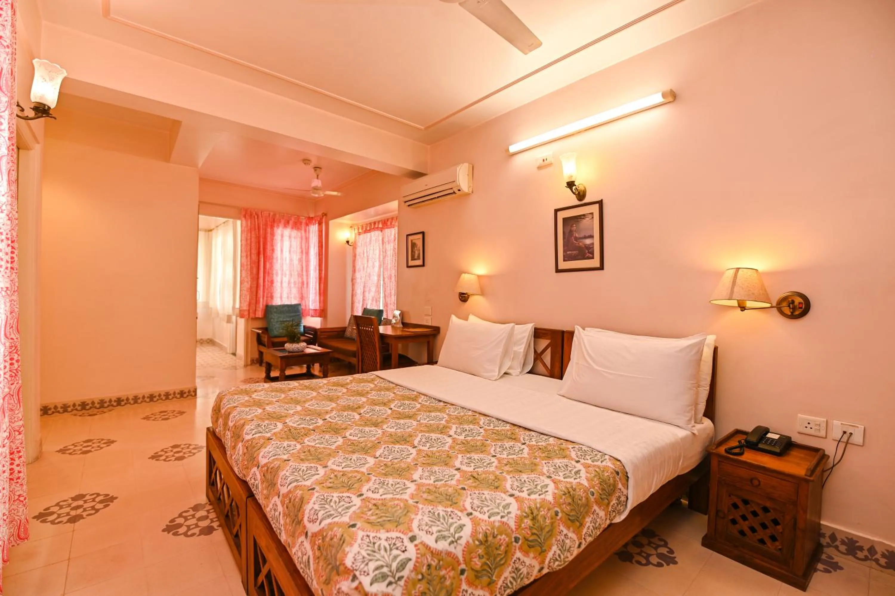 Seating area, Bed in Om Niwas Suite Hotel