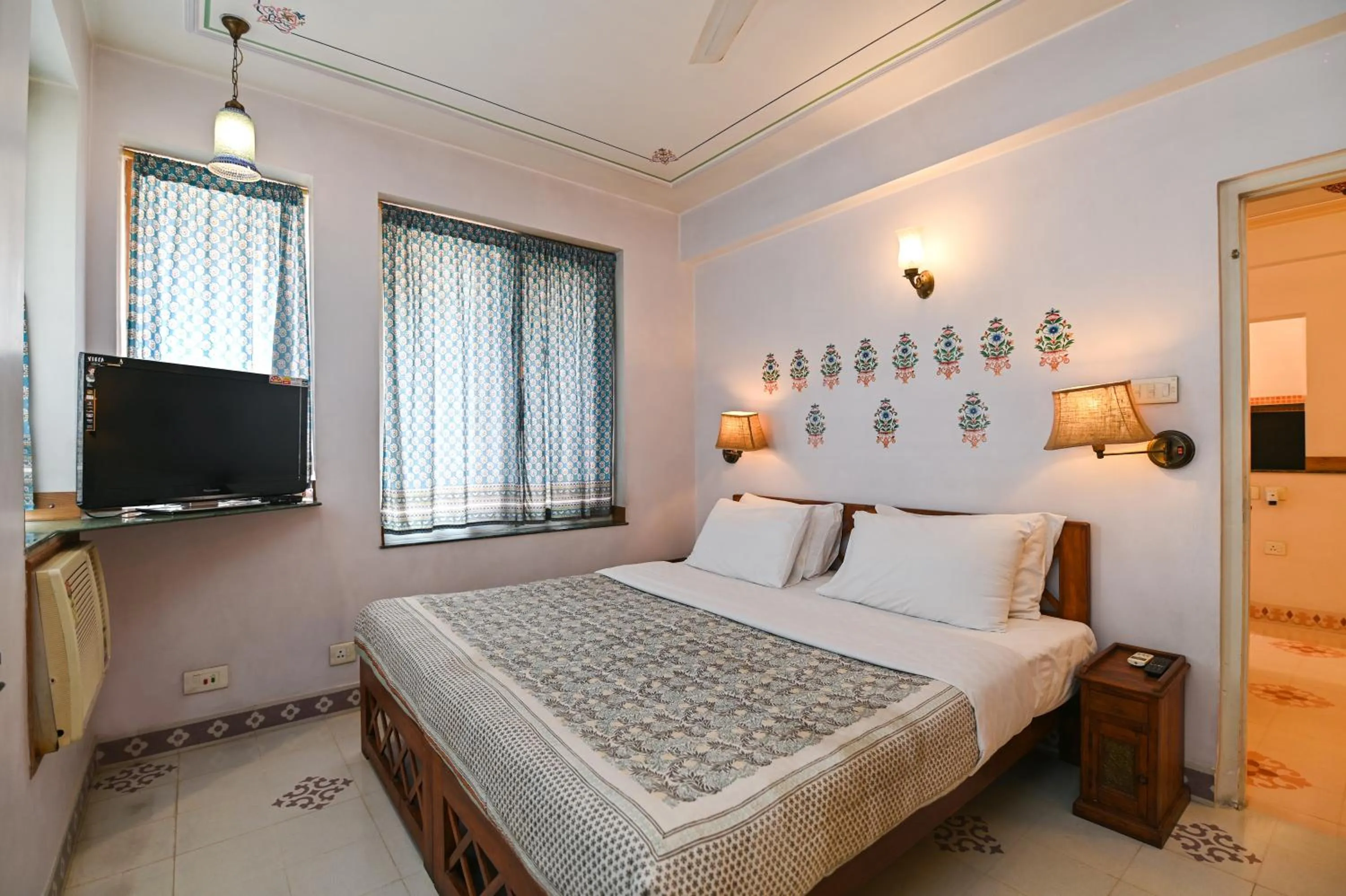 Bed in Om Niwas Suite Hotel